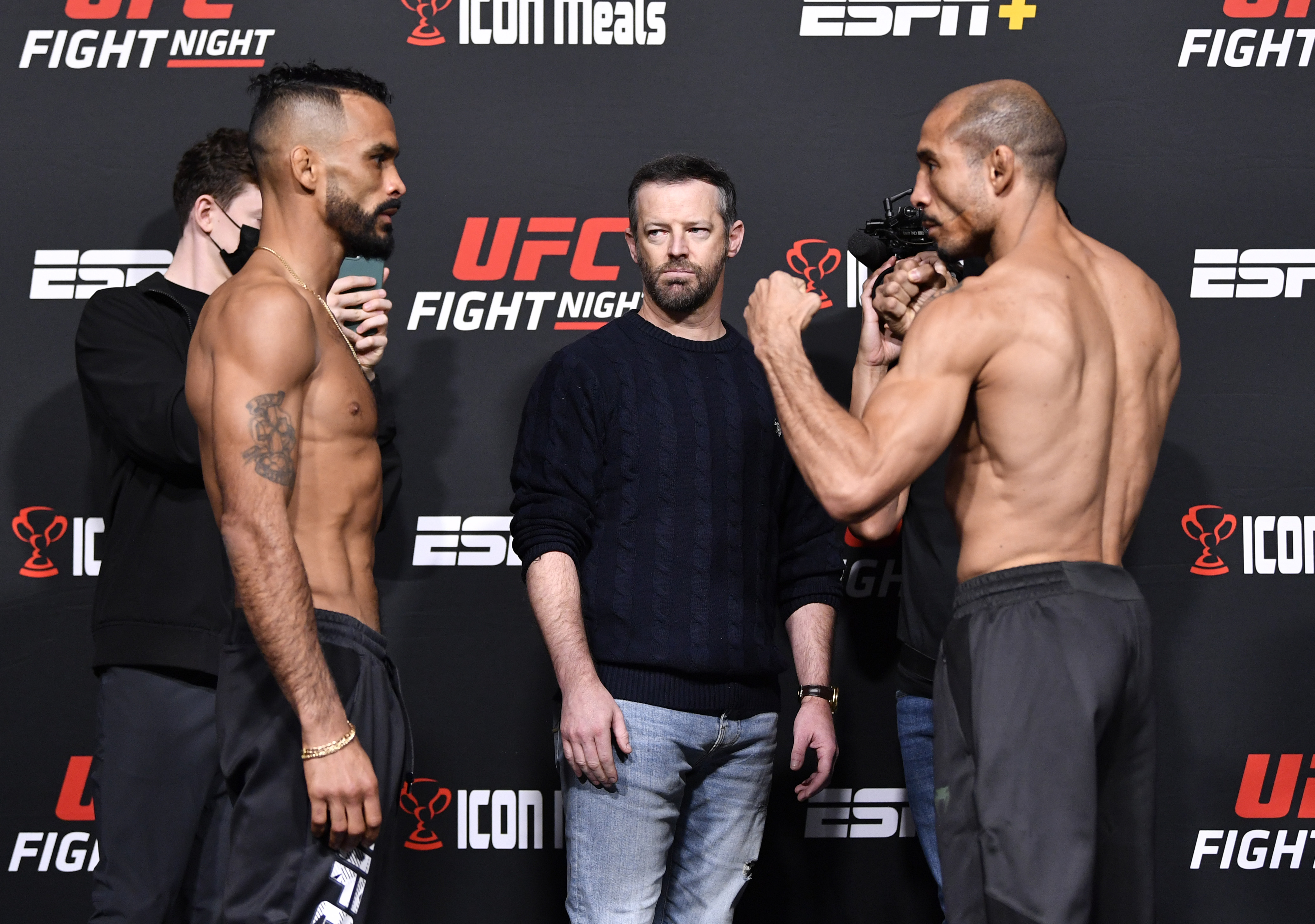 Opponents Rob Font and Jose Aldo of Brazil face off during the UFC Fight Night weigh-in at UFC APEX on December 03, 2021 in Las Vegas, Nevada.