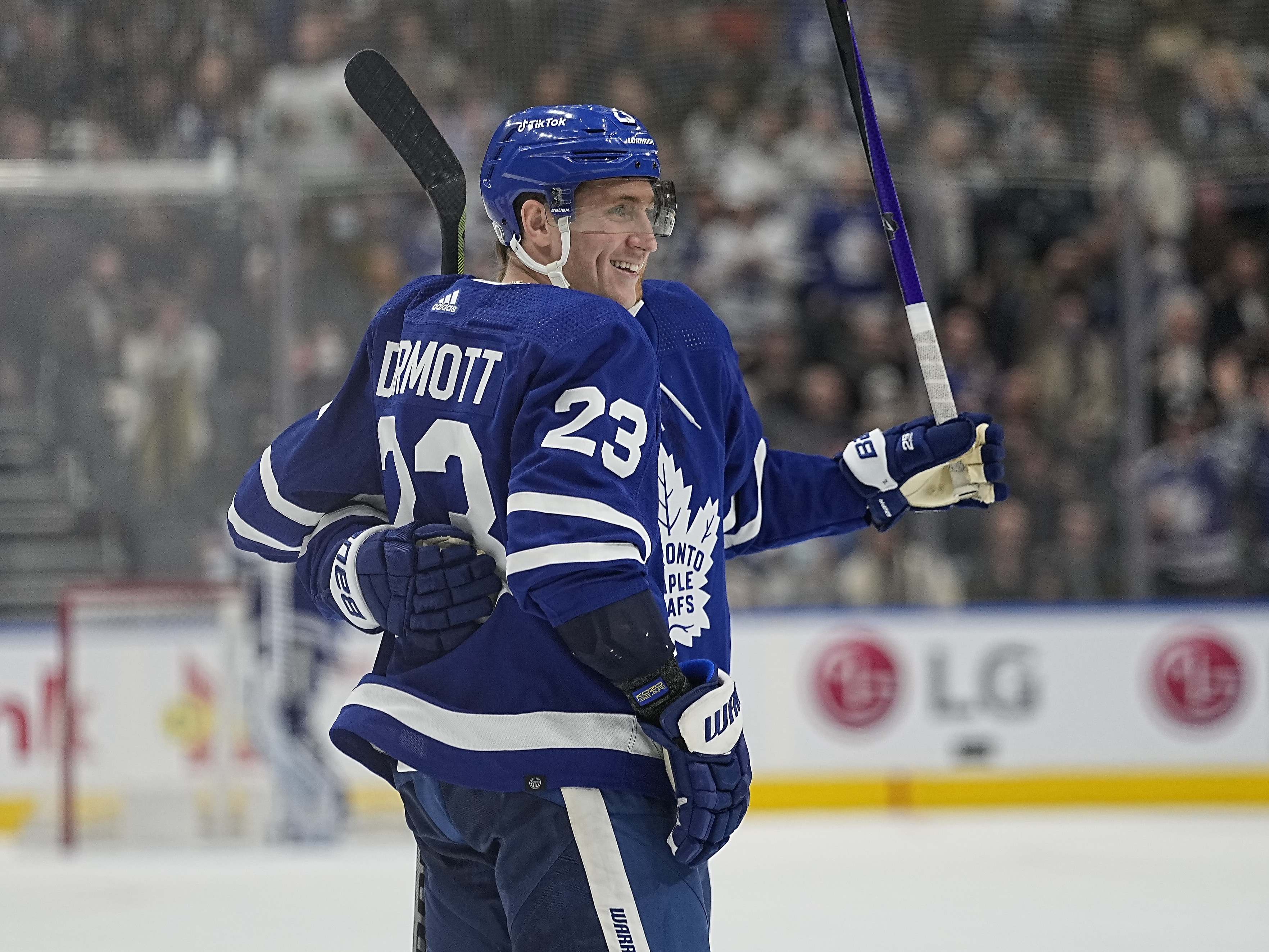 Dec 1, 2021; Toronto, Ontario, CAN; Toronto Maple Leafs defenseman Travis Dermott (23) celebrates his goal against the Colorado Avalanche with Toronto Maple Leafs forward William Nylander (88) during the second period at Scotiabank Arena.
