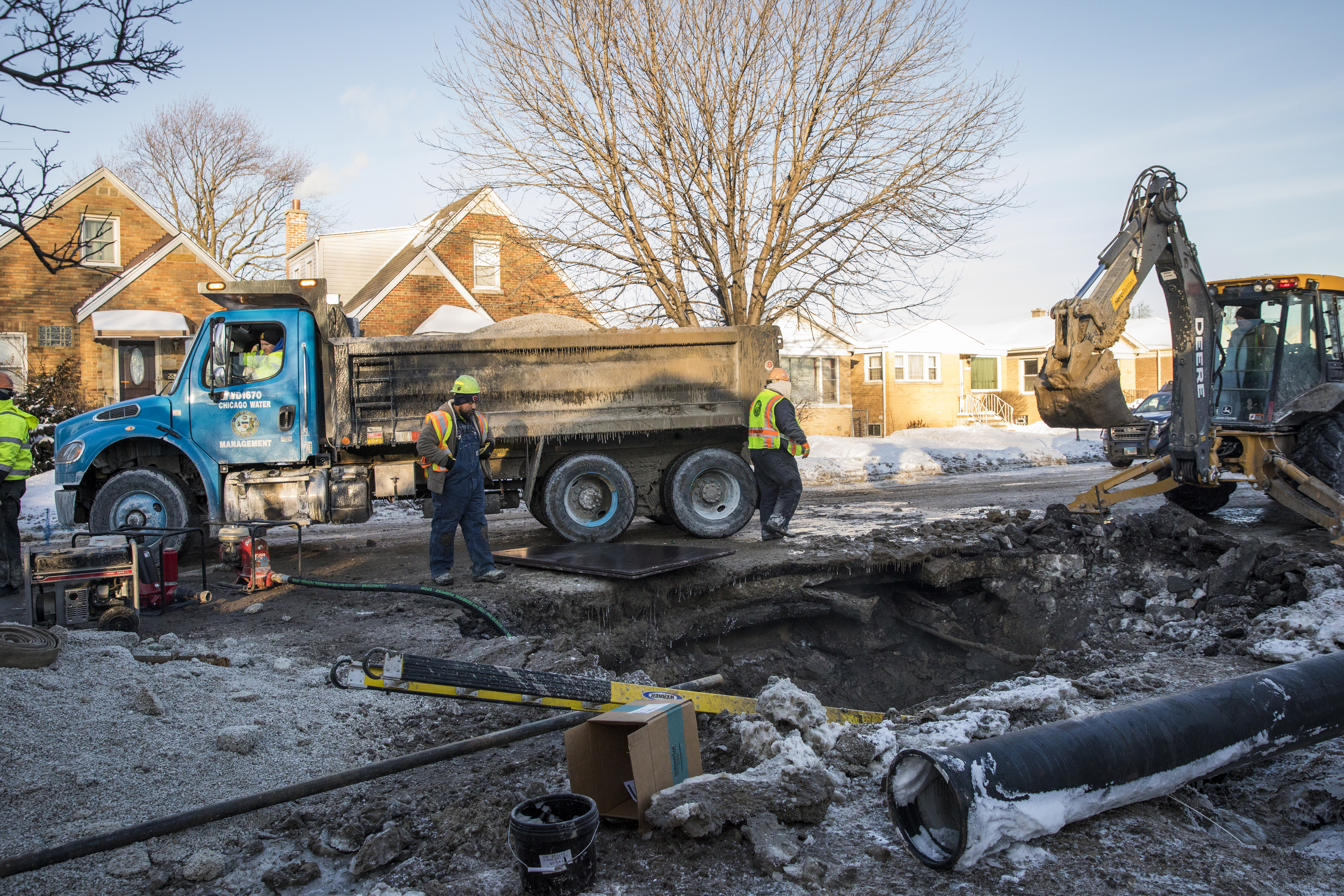 Chicago Department of Water Management employees at a water main break on the Northwest Side in January 2019.