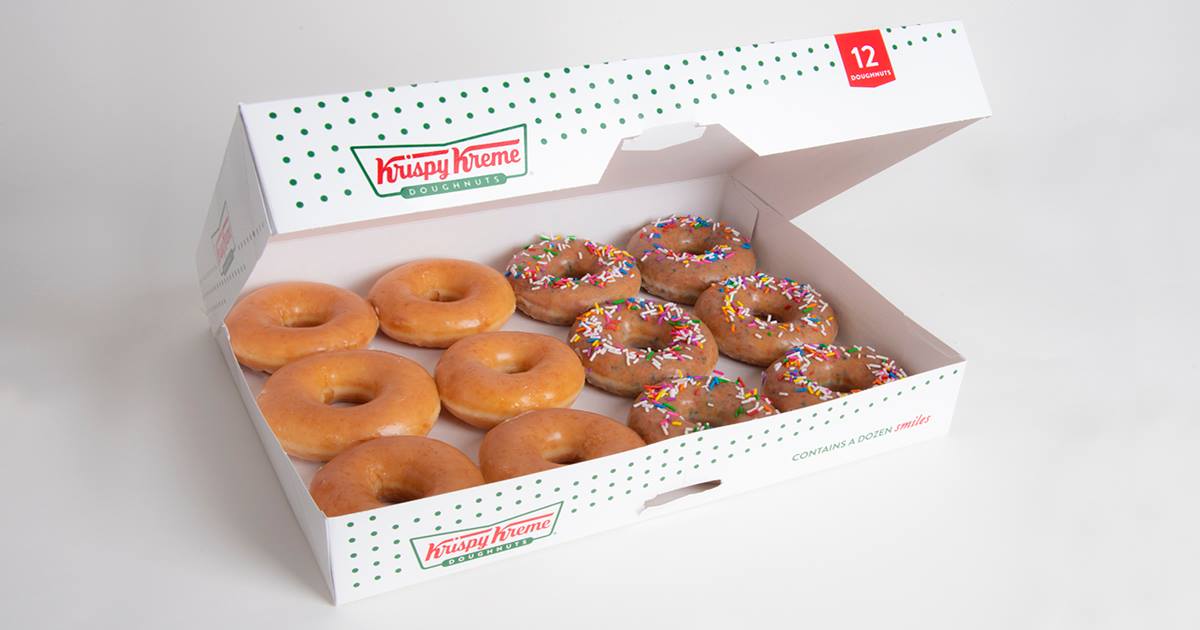 A box of a dozen glazed and sprinkle doughnuts