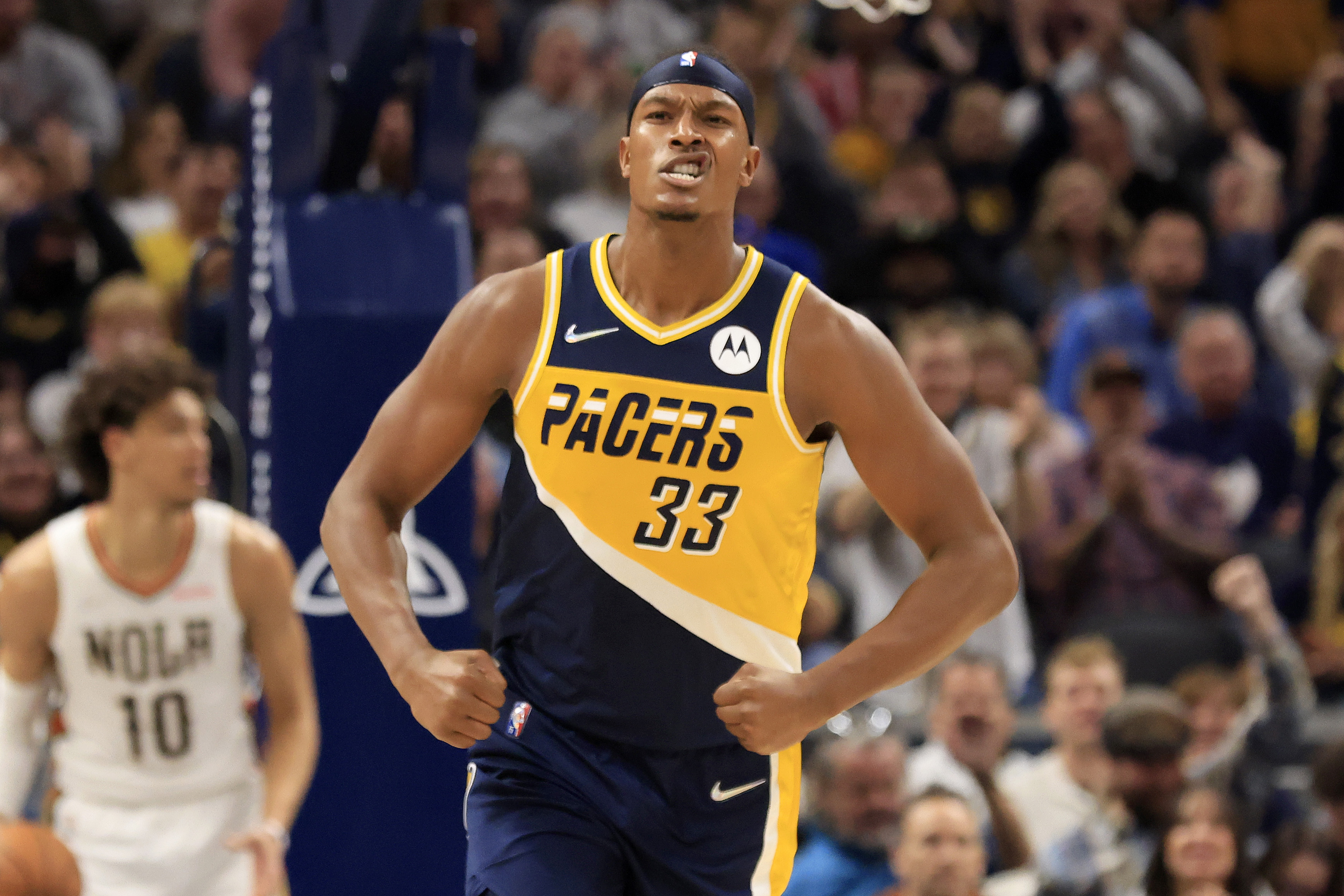 Myles Turner #33 of the Indiana Pacers reacts after a dunk in the game against the New Orleans Pelicans during the third quarter at Gainbridge Fieldhouse on November 20, 2021 in Indianapolis, Indiana.