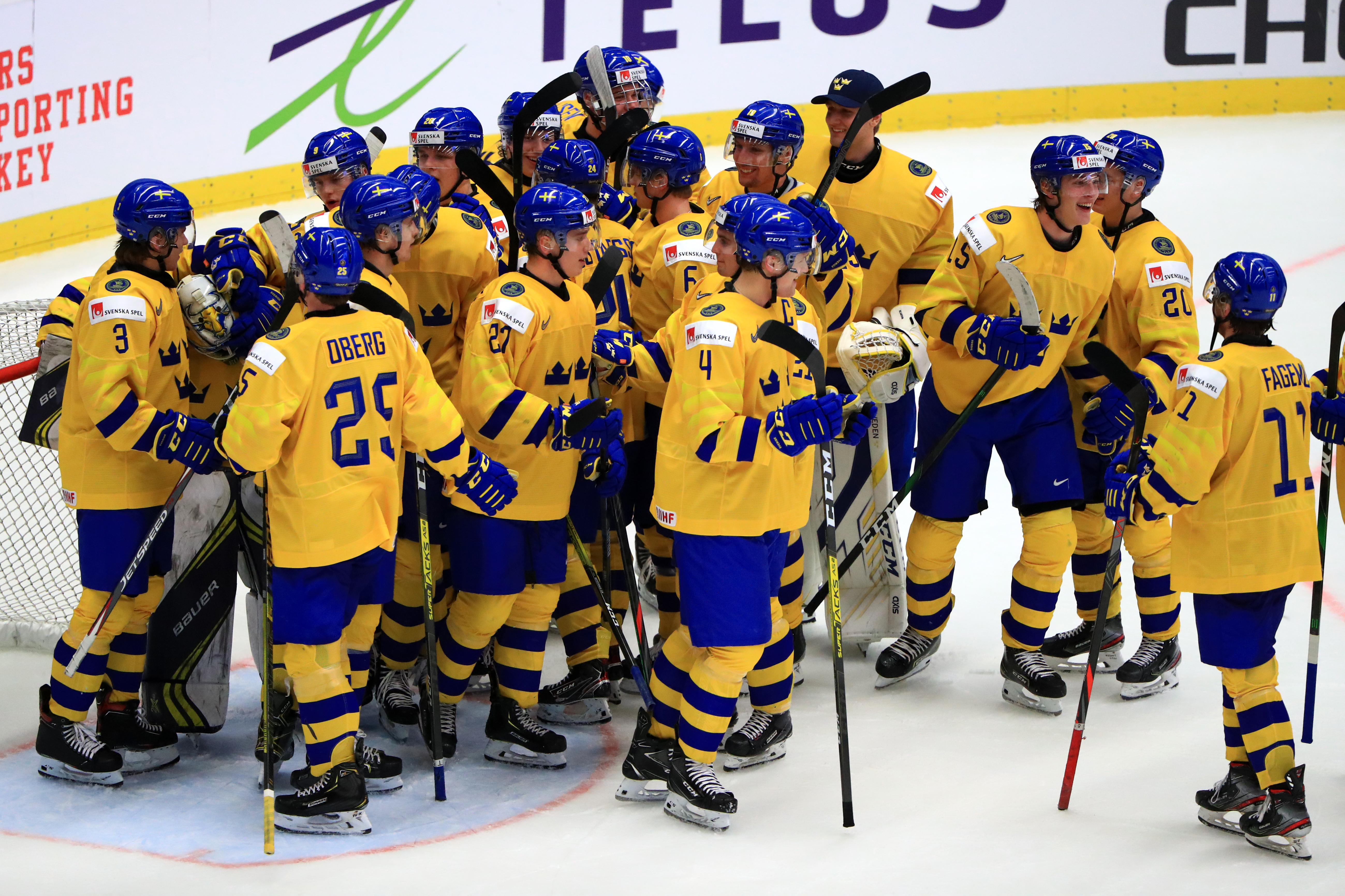 OSTRAVA, CZECH REPUBLIC - JANUARY 2, 2020: Swedish players celebrate after their 2020 IIHF World Junior Ice Hockey Championship quarter-final match against the Czech Republic at Ostravar Arena; Sweden won 5-0.