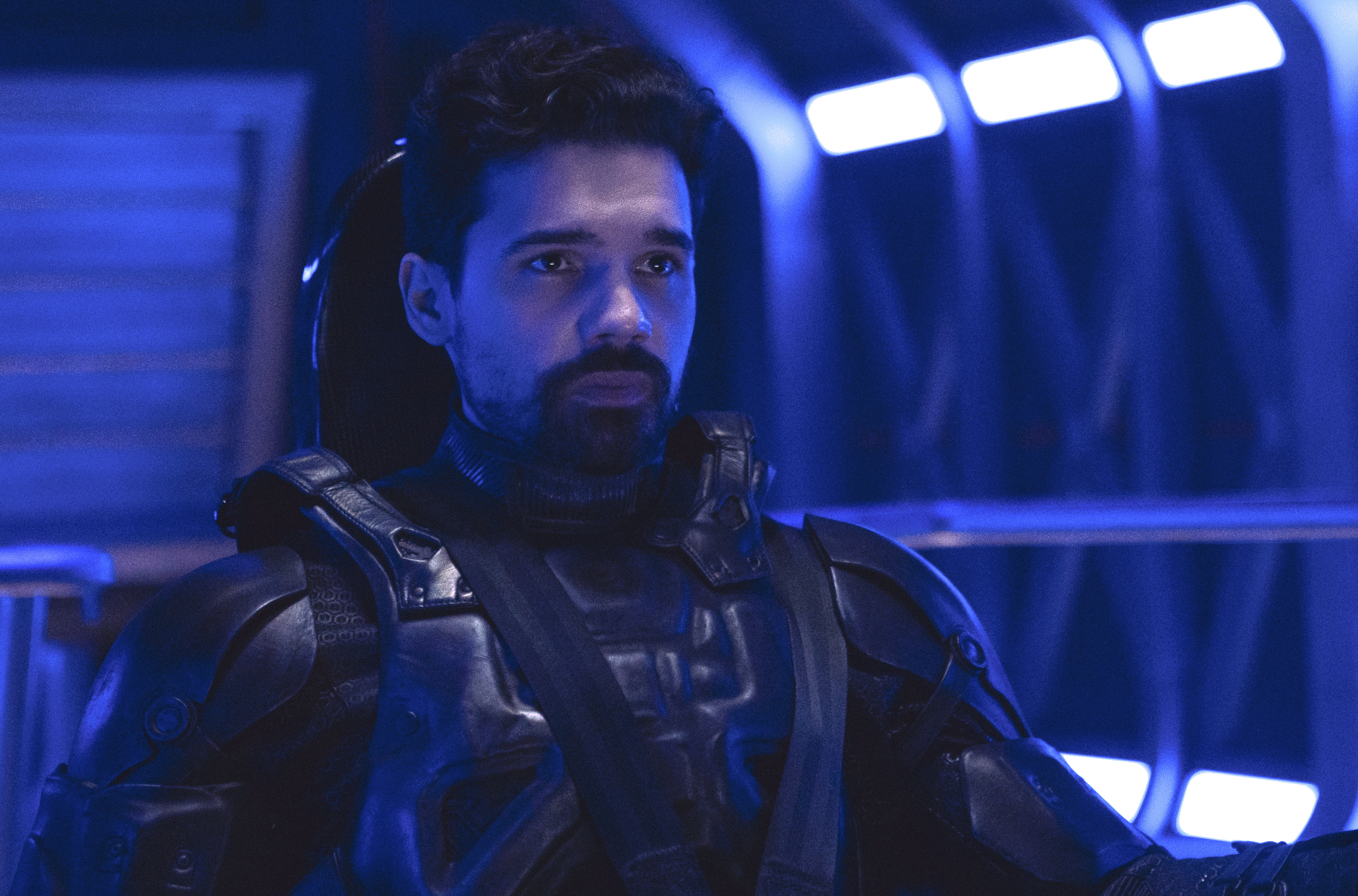 Holden sits in a spaceship chair (lol) in The Expanse season 6