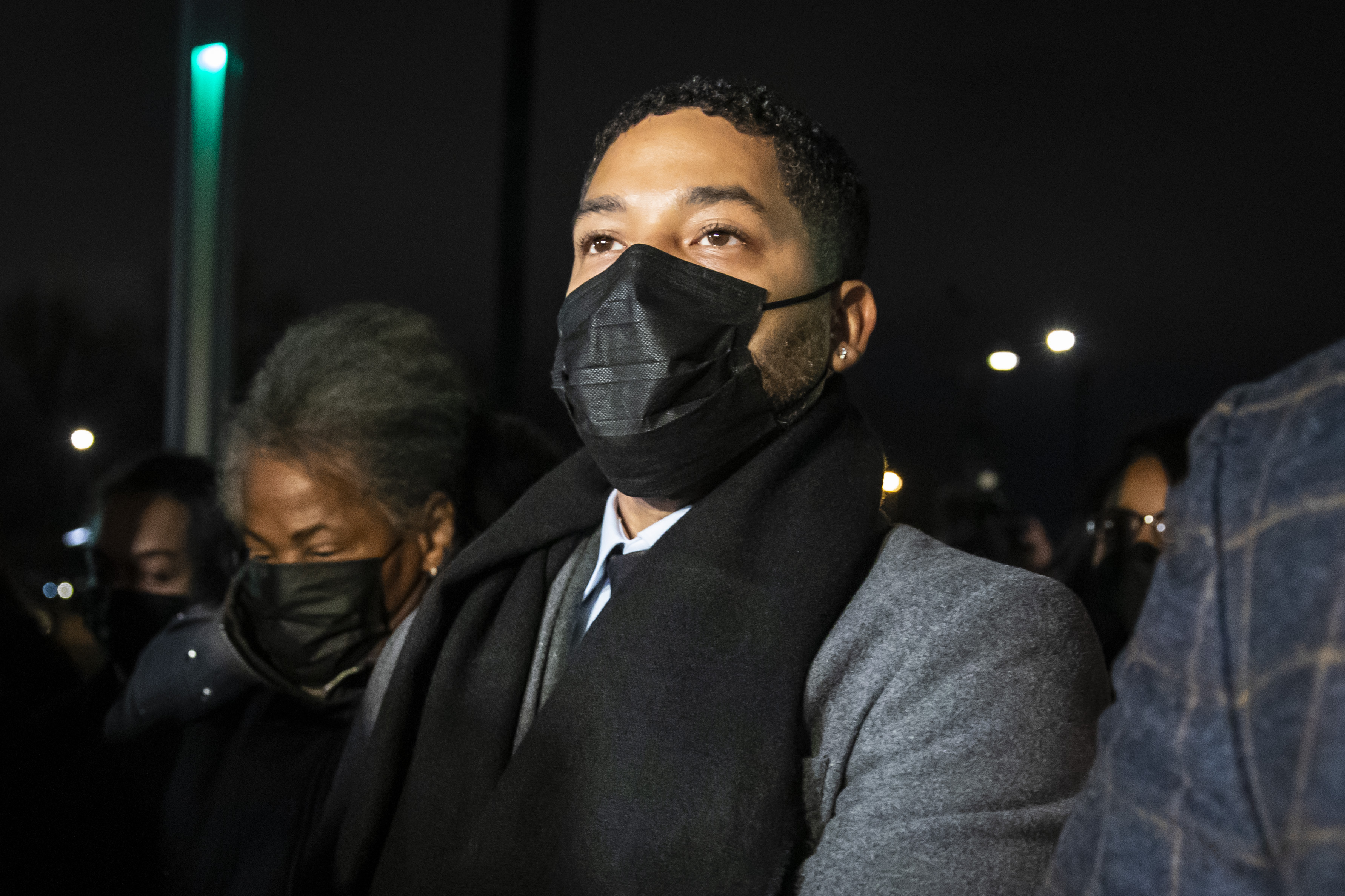 Flanked by family members, supporters, attorneys and bodyguards, former “Empire” star Jussie Smollett walks into the Leighton Criminal Courthouse after the jury reached a verdict, Thursday evening. 