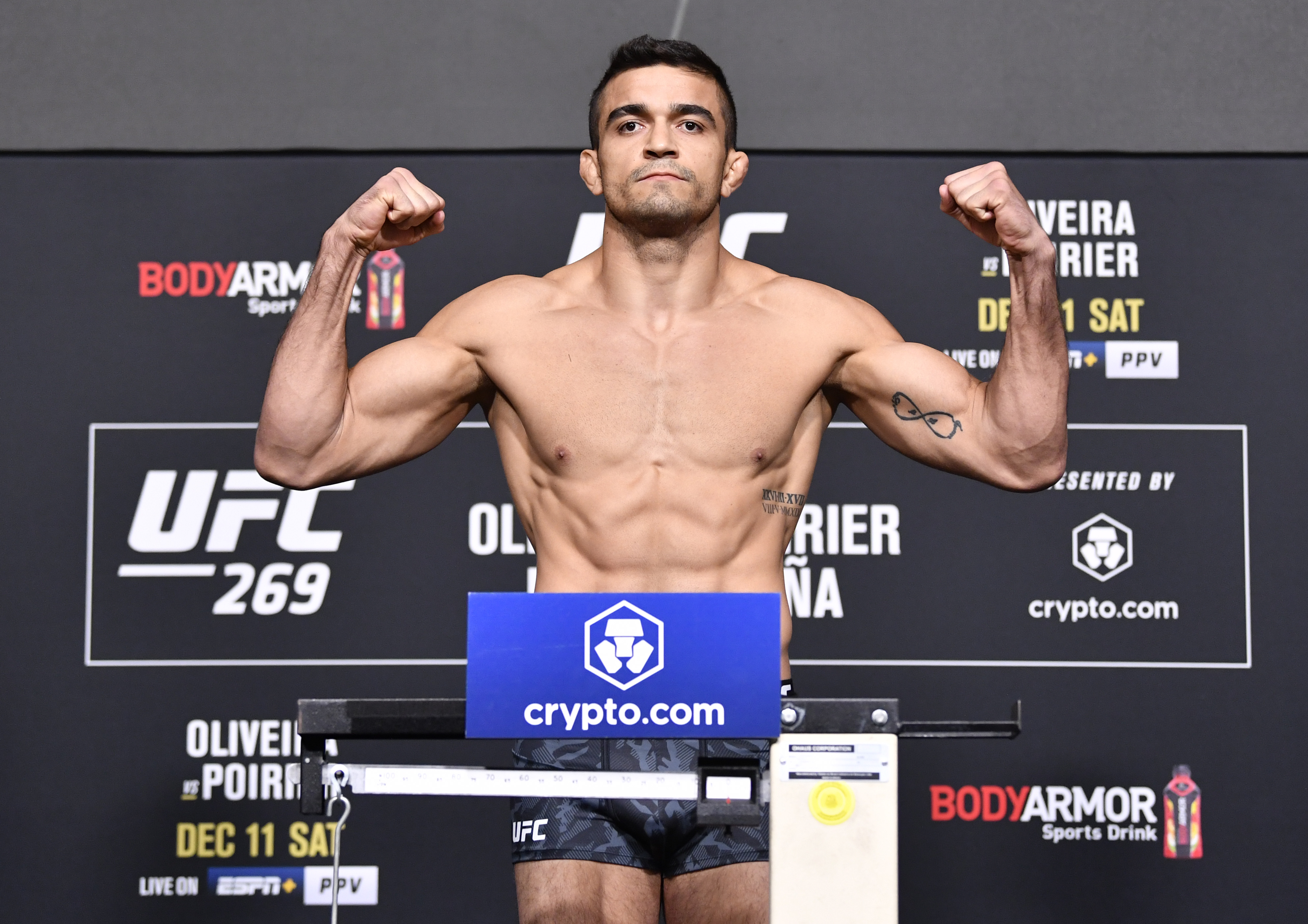 Andre Muniz of Brazil poses on the scale during the UFC 269 official weigh-in at UFC APEX on December 10, 2021 in Las Vegas, Nevada.