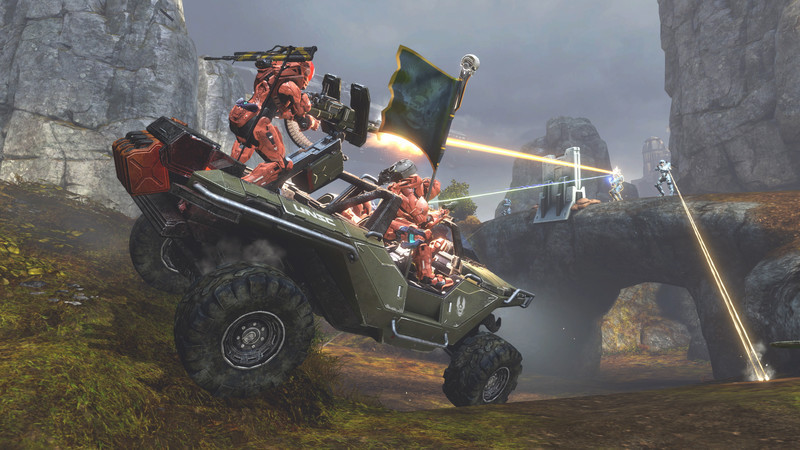 Two players in a warthog shooting at enemies in Halo multiplayer