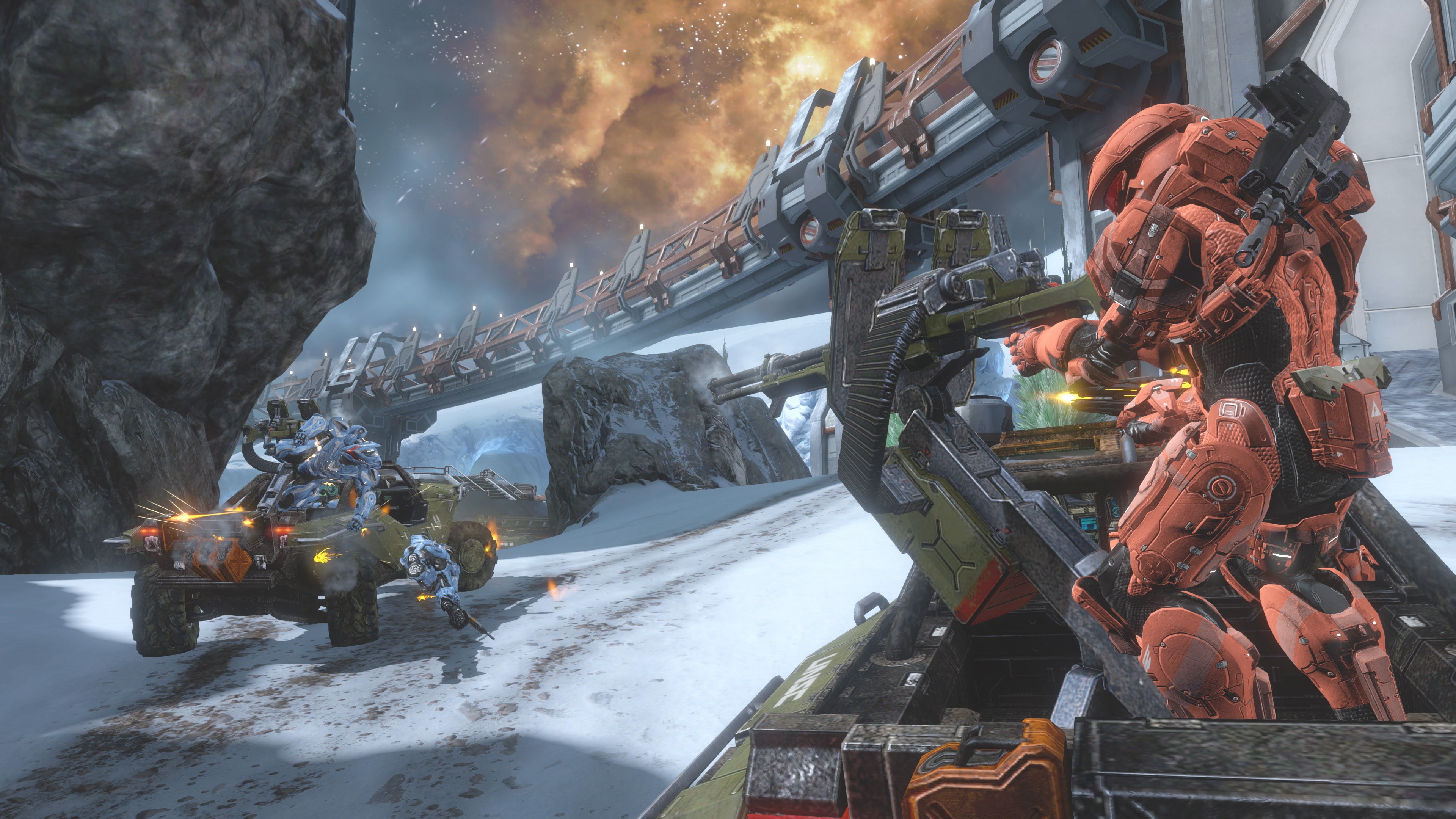 Spartans in red and blue battle each other on a snowy map in Halo 4 multiplayer