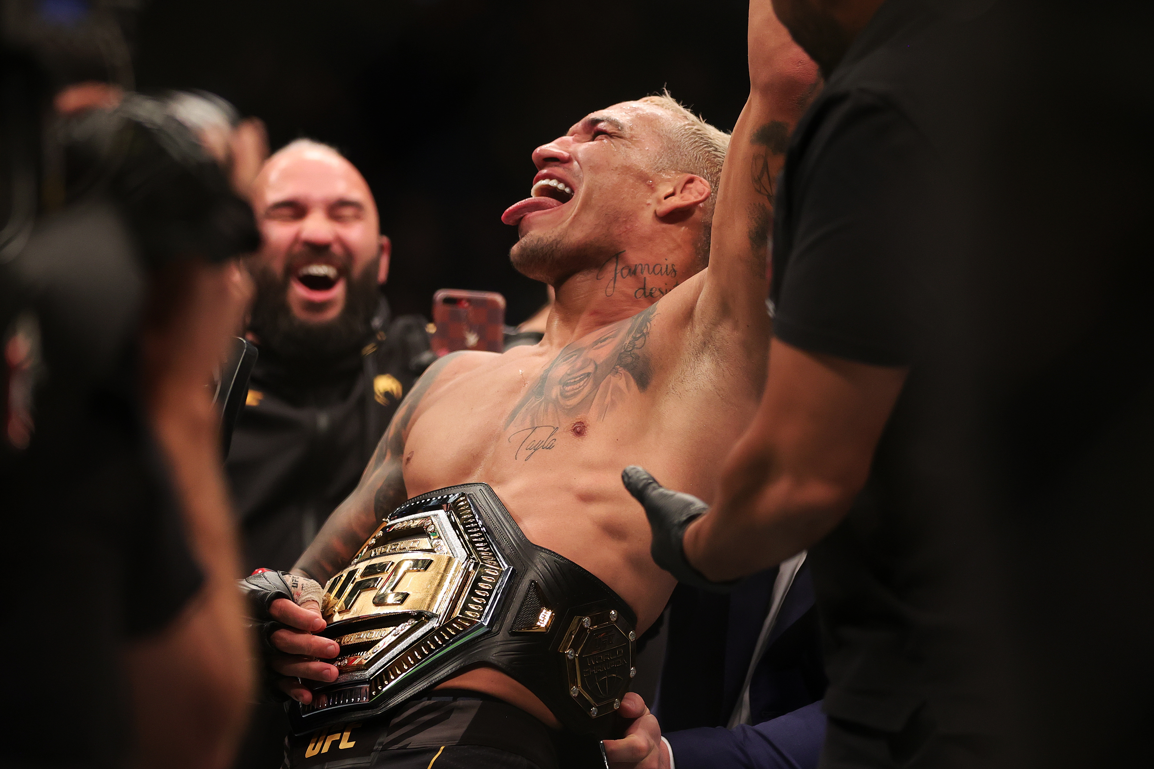 Charles Oliveira celebrates after his UFC 269 win over Dustin Poirier. 