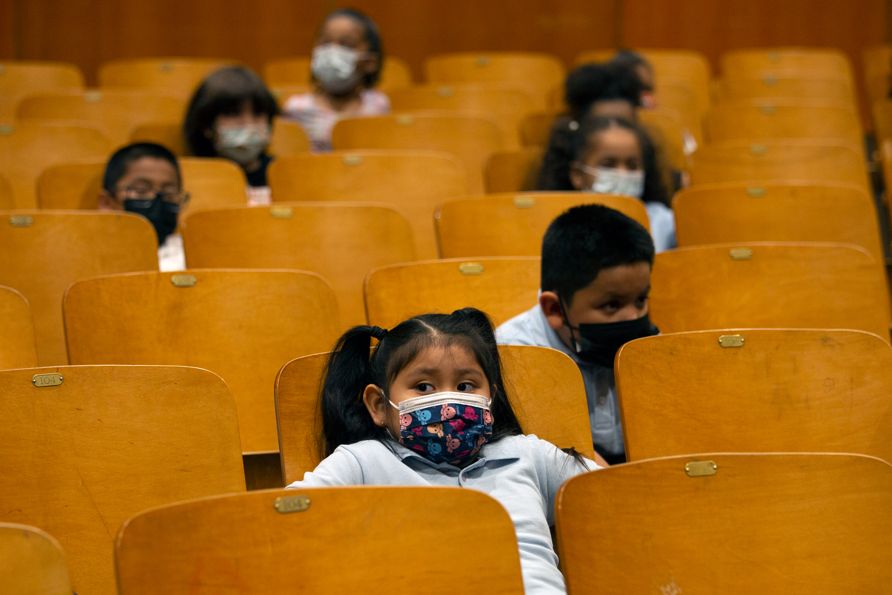Students at P.S. 179 in the South Bronx wear masks during a holiday event, Dec. 17, 2021.