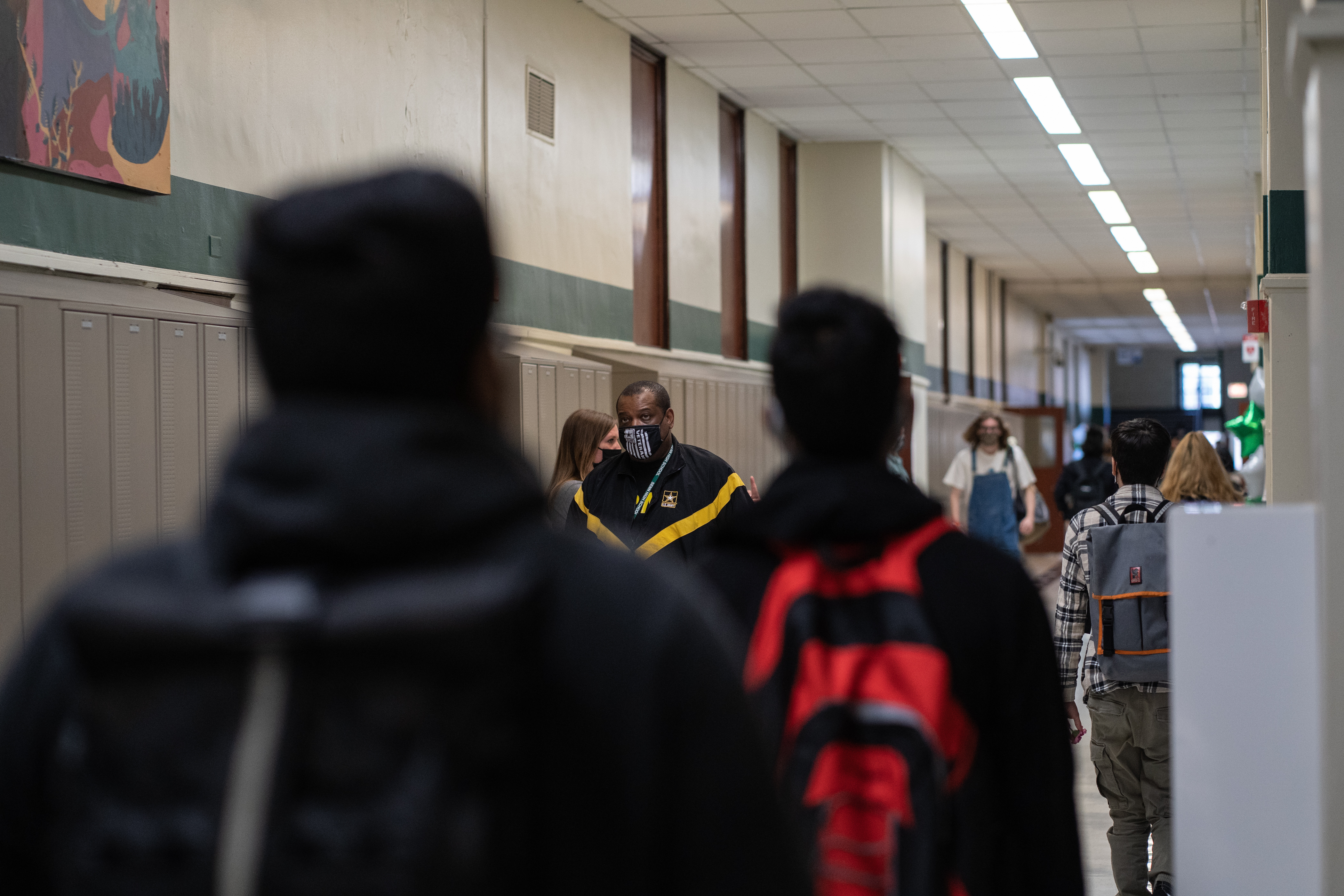 Students and staff walk the halls of Senn High School on the first week back to classrooms on April 23, 2021.