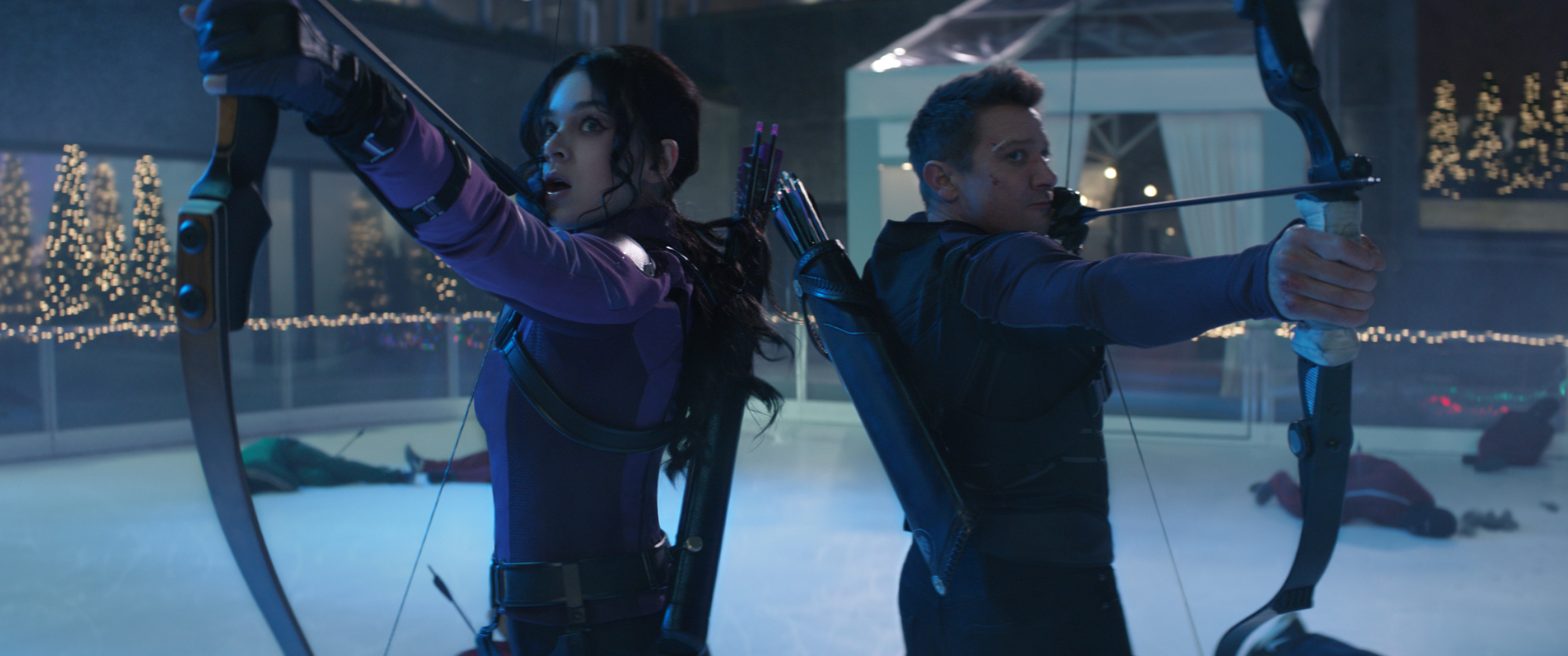 Hailee Steinfeld and Jeremy Renner prepare to fire arrows on Hawkeye