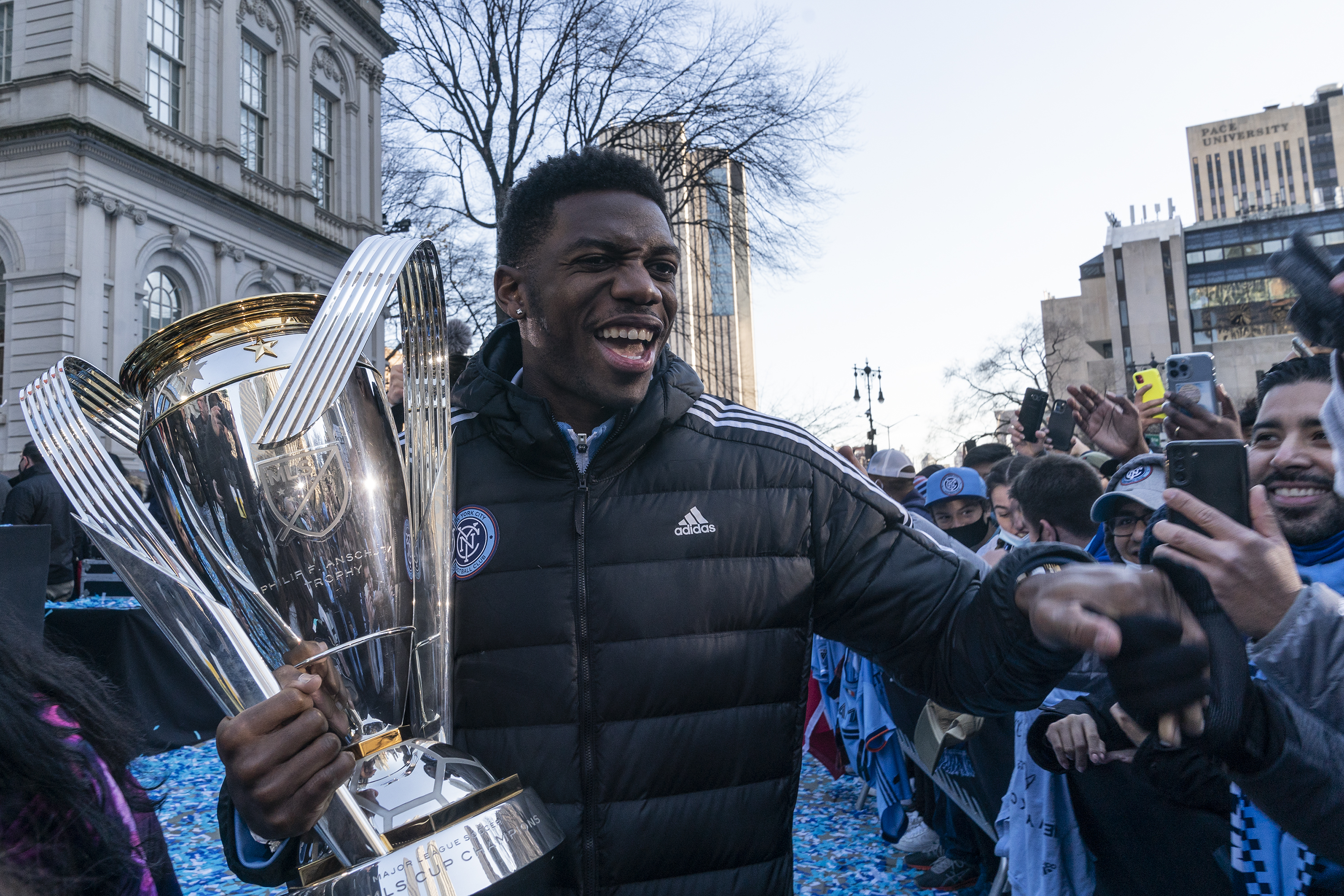 Goalkeeper Sean Johnson with MLS Cup poses and greets fans...