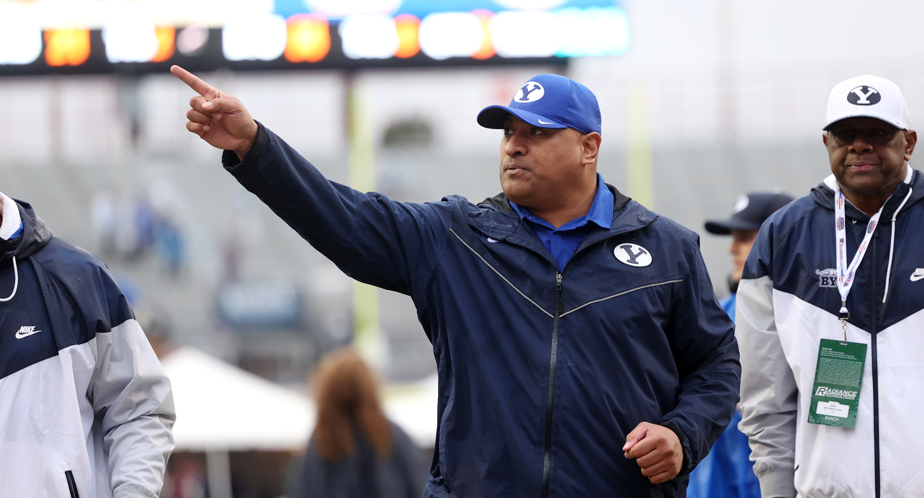 Brigham Young Cougars head coach Kalani Sitake waves to fans as he goes into the locker room.