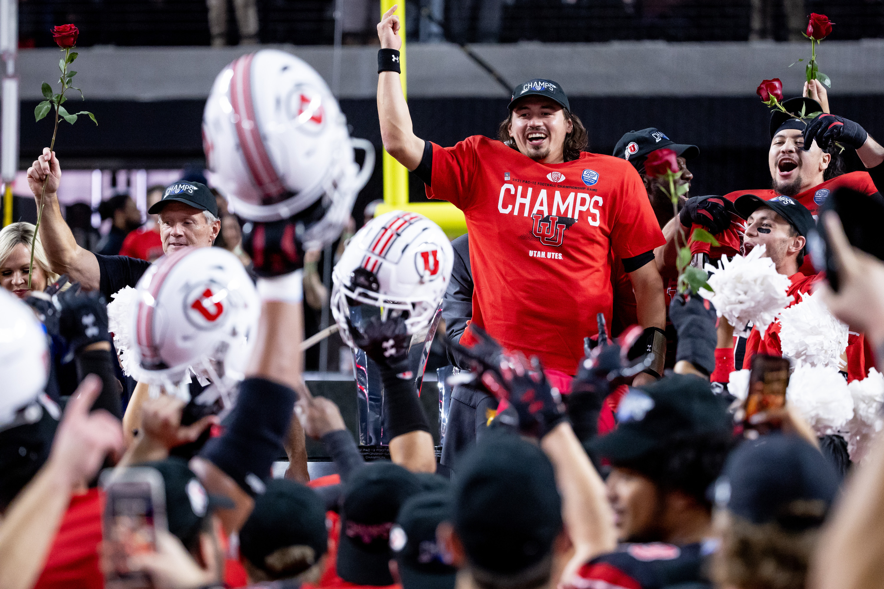 Utah quarterback Cam Rising (7) and teammates celebrate after the Utes beat the Oregon Ducks in the Pac-12 championship game.