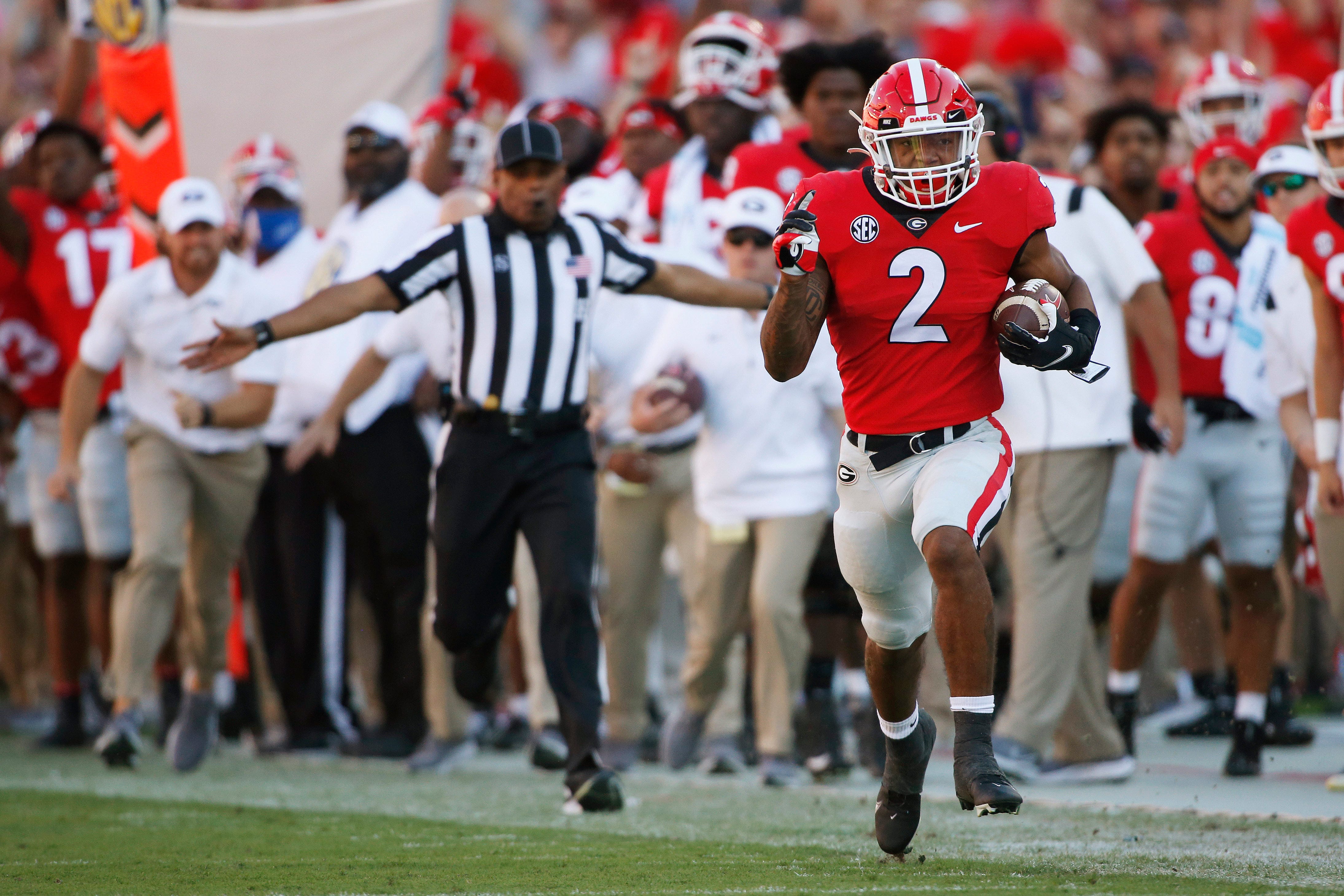 Georgia running back Kendall Milton breaks away down the sideline for a big gain during the first half of an NCAA college football game between Kentucky and Georgia in Athens, Ga., on Saturday, Oct. 16, 2021.