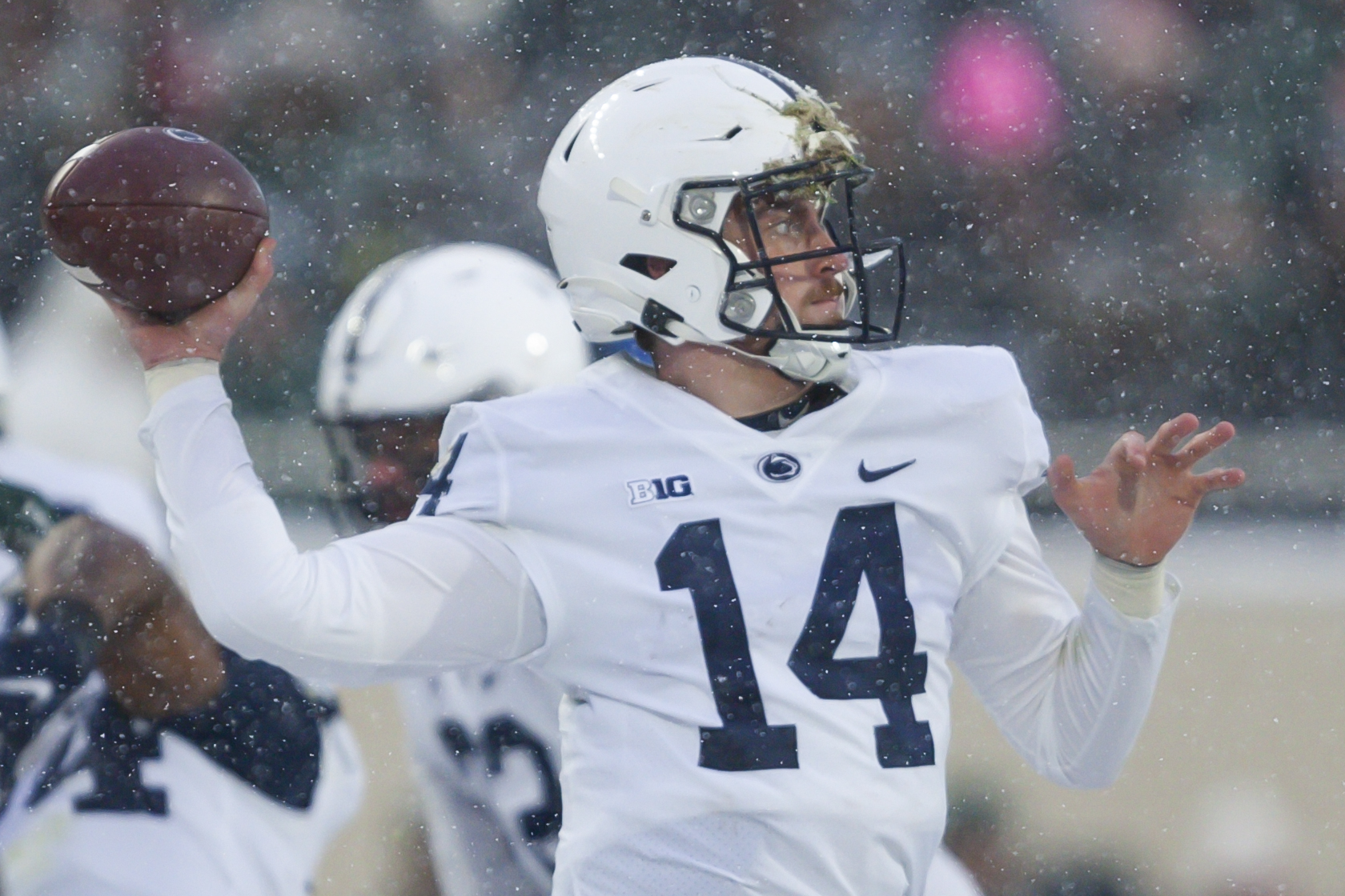 Penn State Nittany Lions quarterback Sean Clifford (14) passes the ball during the first quarter against the Michigan State Spartans at Spartan Stadium.