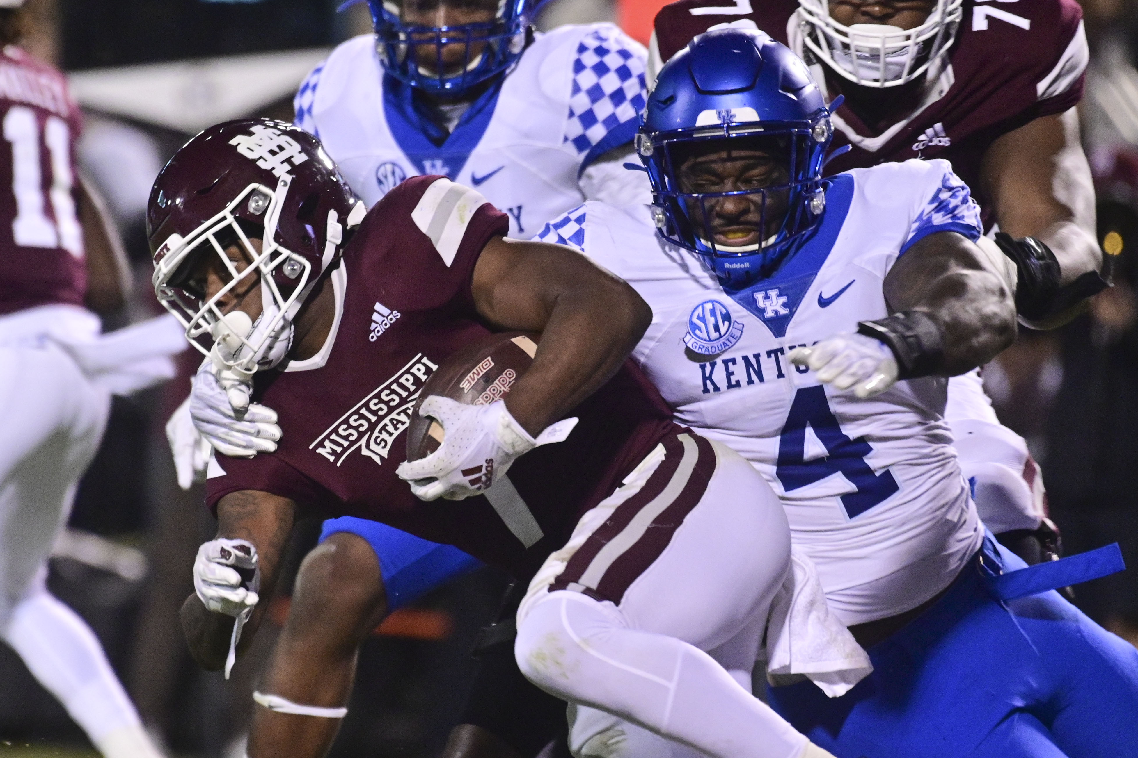 Mississippi State Bulldogs running back Jo’quavious Marks runs the ball while defended by Kentucky Wildcats defensive end Josh Paschal during the second quarter at Davis Wade Stadium at Scott Field.