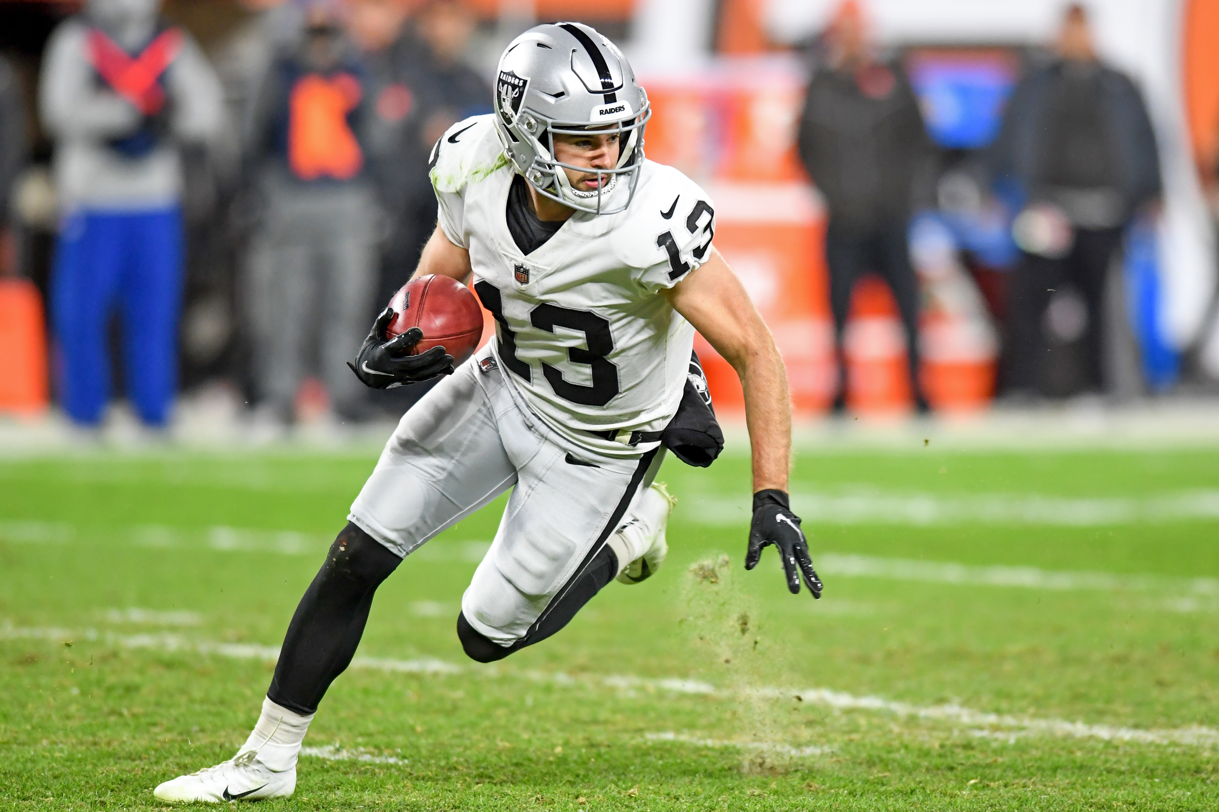 Hunter Renfrow #13 of the Las Vegas Raiders returns a punt during the second half against the Cleveland Browns at FirstEnergy Stadium in Cleveland, Ohio.