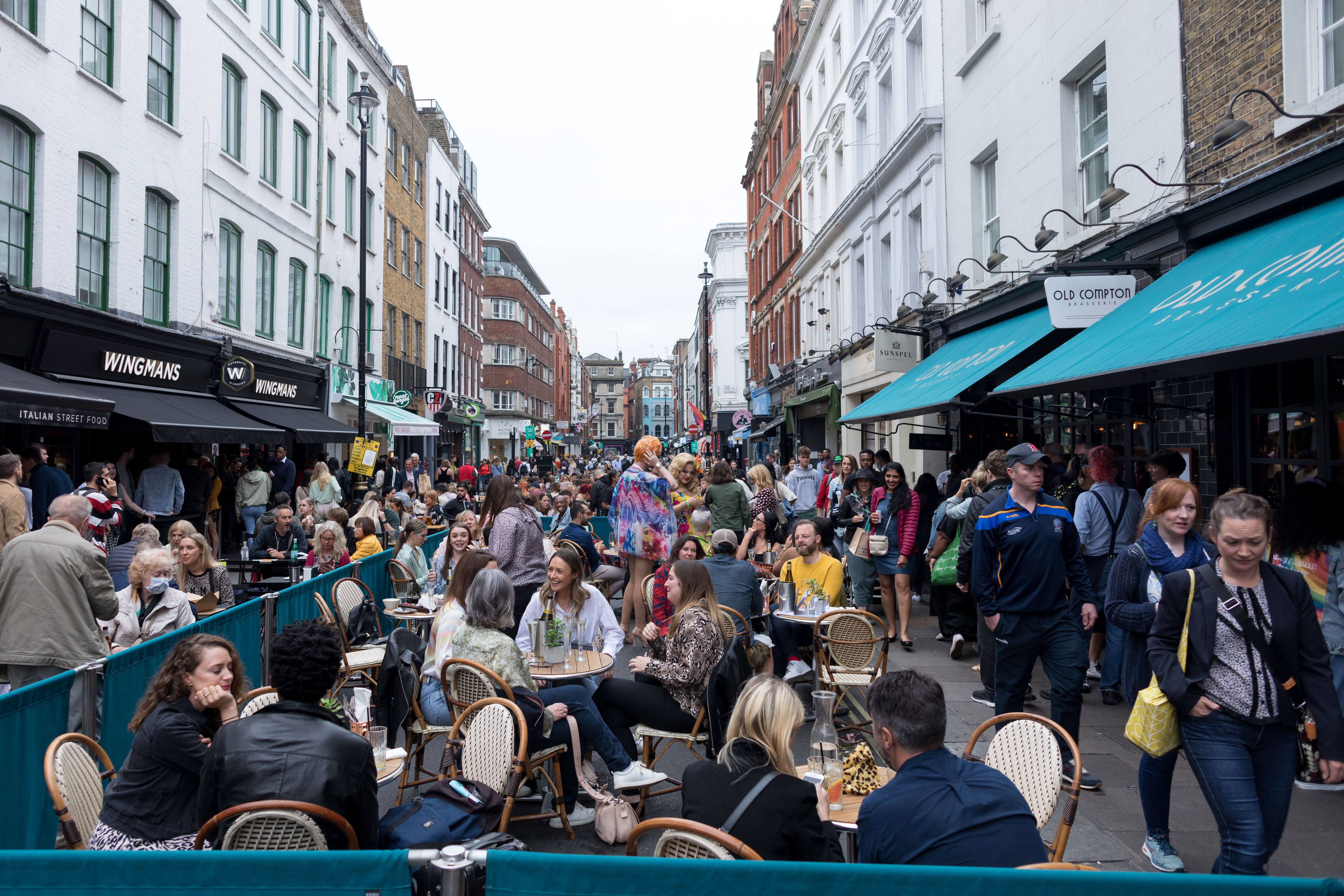 People seen dining outdoors in Soho after covid-19...