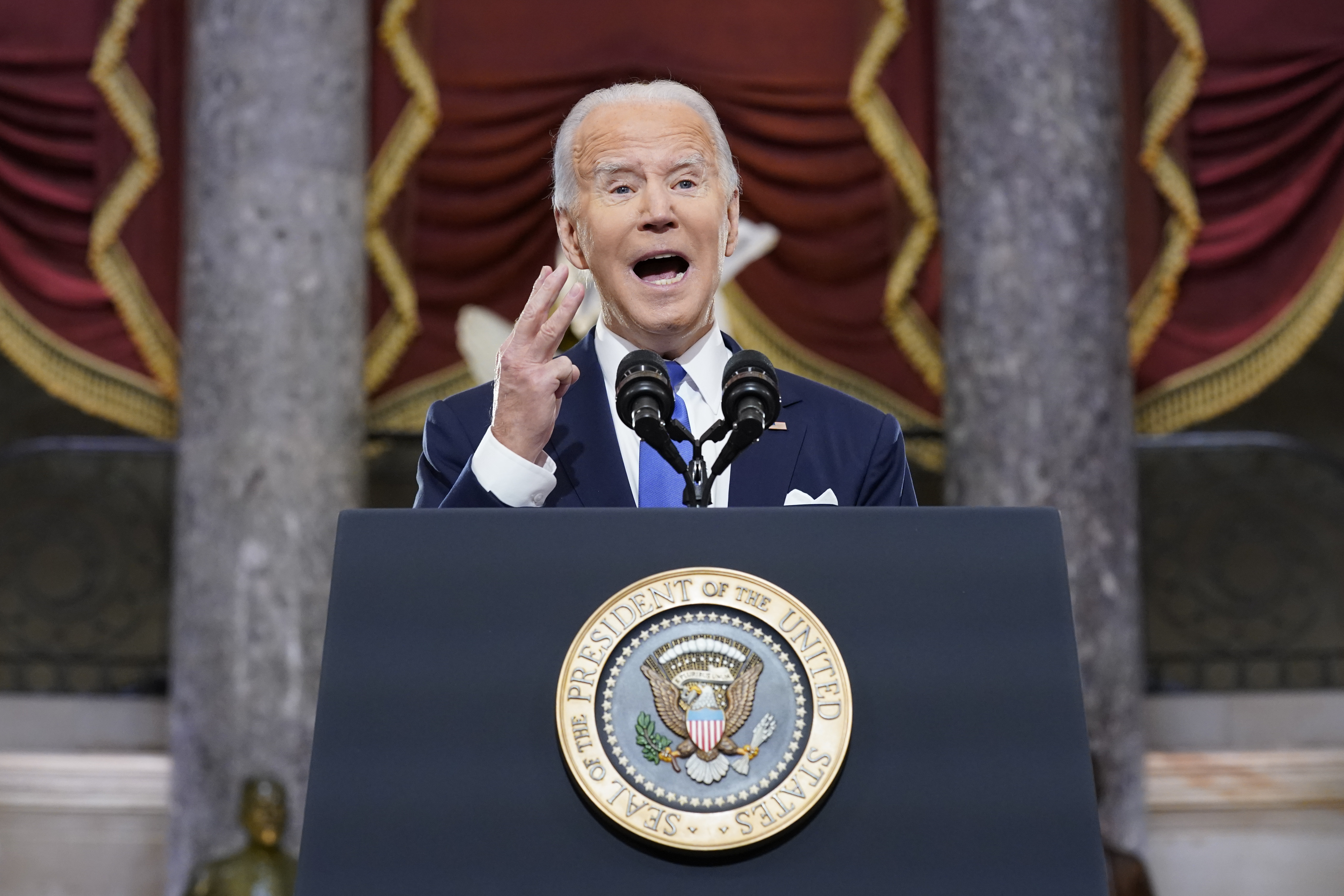 President Joe Biden speaks from Statuary Hall at the U.S. Capitol to mark the one year anniversary of the Jan. 6 riot at the Capitol by supporters loyal to then-President Donald Trump, Thursday, Jan. 6, 2022, in Washington. 