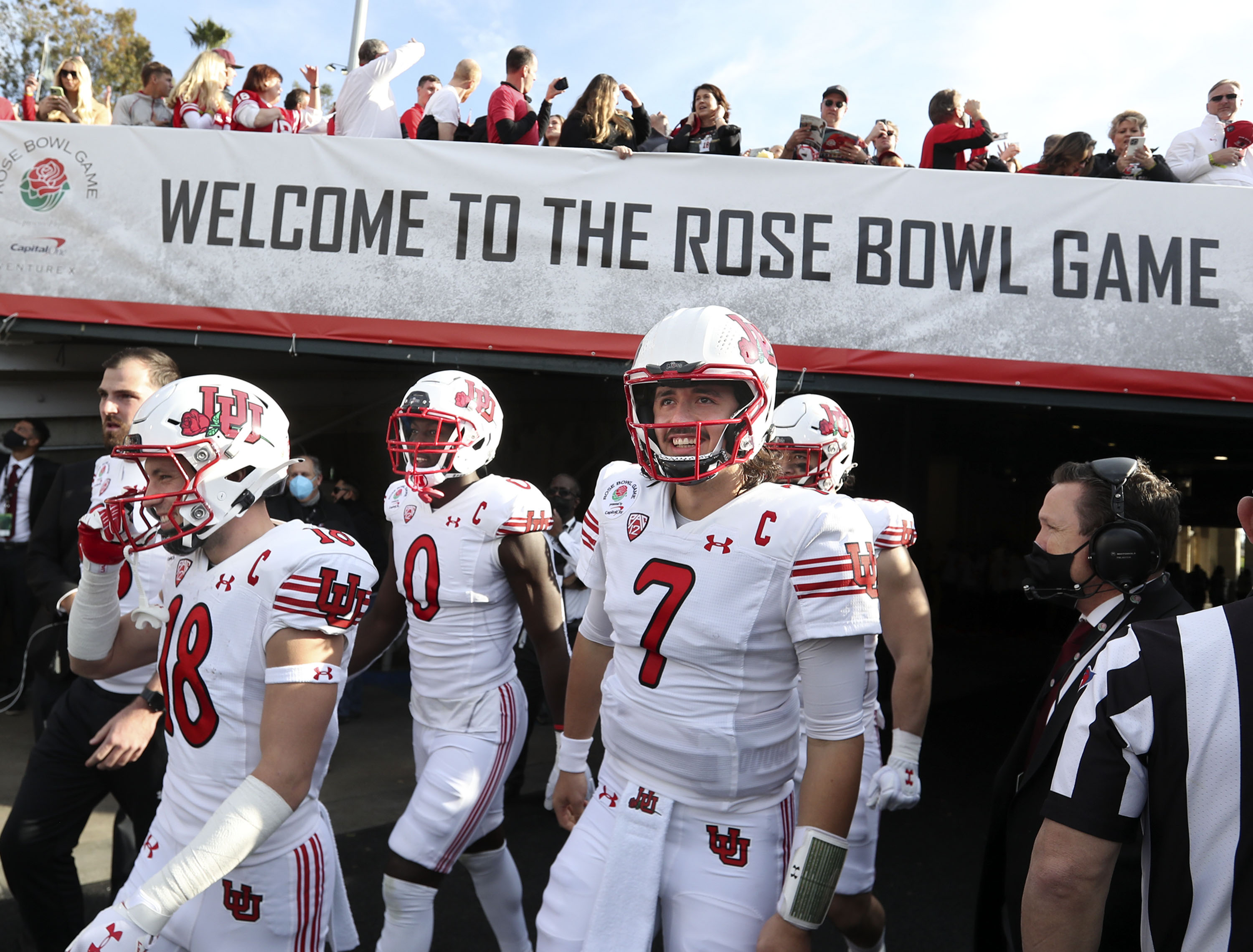 Members of the Utah football team walk onto the field for the game against Ohio State in the Rose Bowl in Pasadena, Calif.