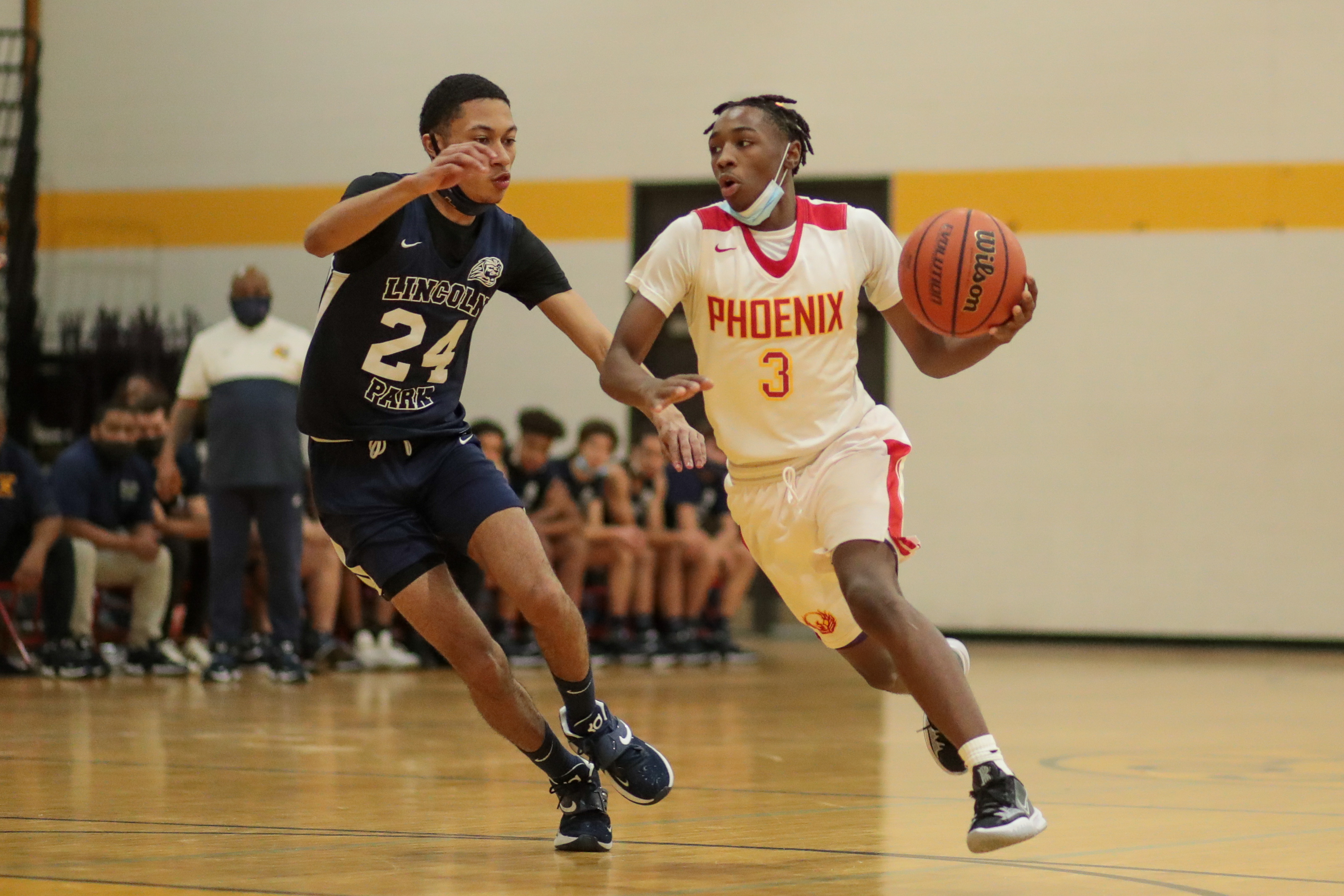 North Lawndale’s Jemarje Windfield (3) drives the ball past Lincoln Park’s Chris Hammonds (24).