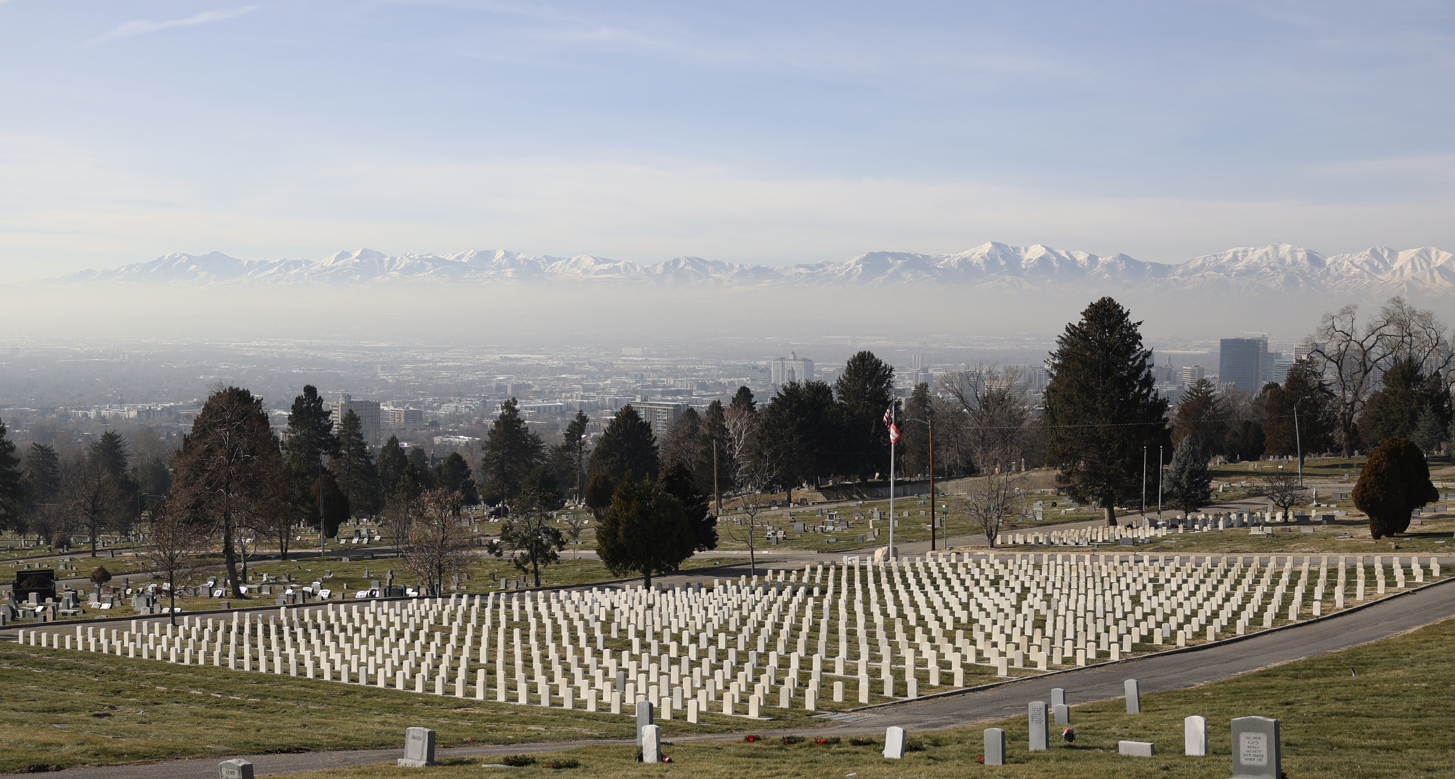 Smog settles over the Salt Lake Valley during an inversion as seen from the Salt Lake City Cemetery in Salt Lake City on Wednesday, Jan. 12, 2022. HB109, sponsored by Rep. Steve Handy, R-Layton, would allow physicians to indicate that poor air quality contributed to an individual’s death on the death certificate.