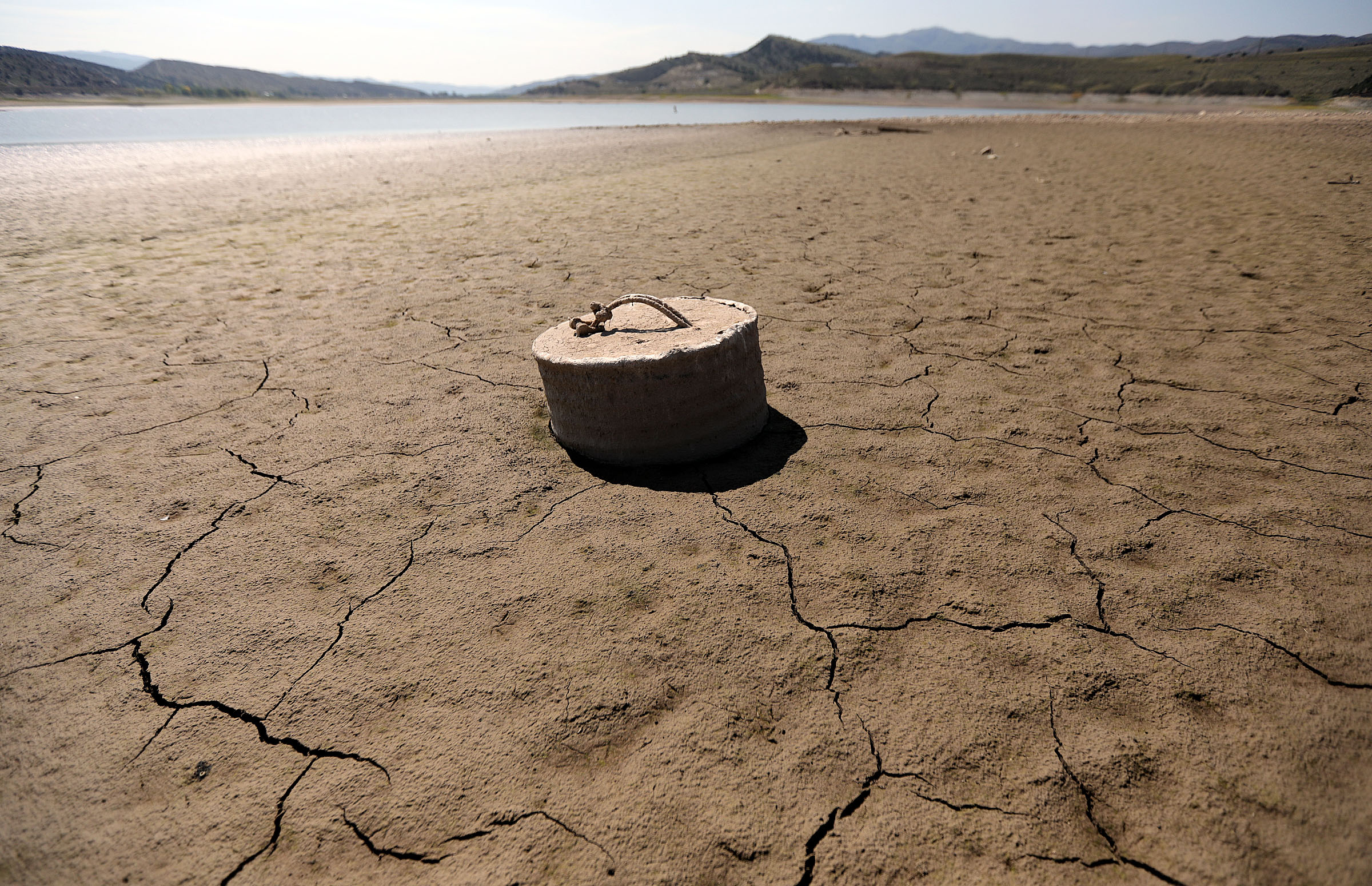 A mooring sinker is pictured on the dried up shore of Echo Reservoir during a drought.