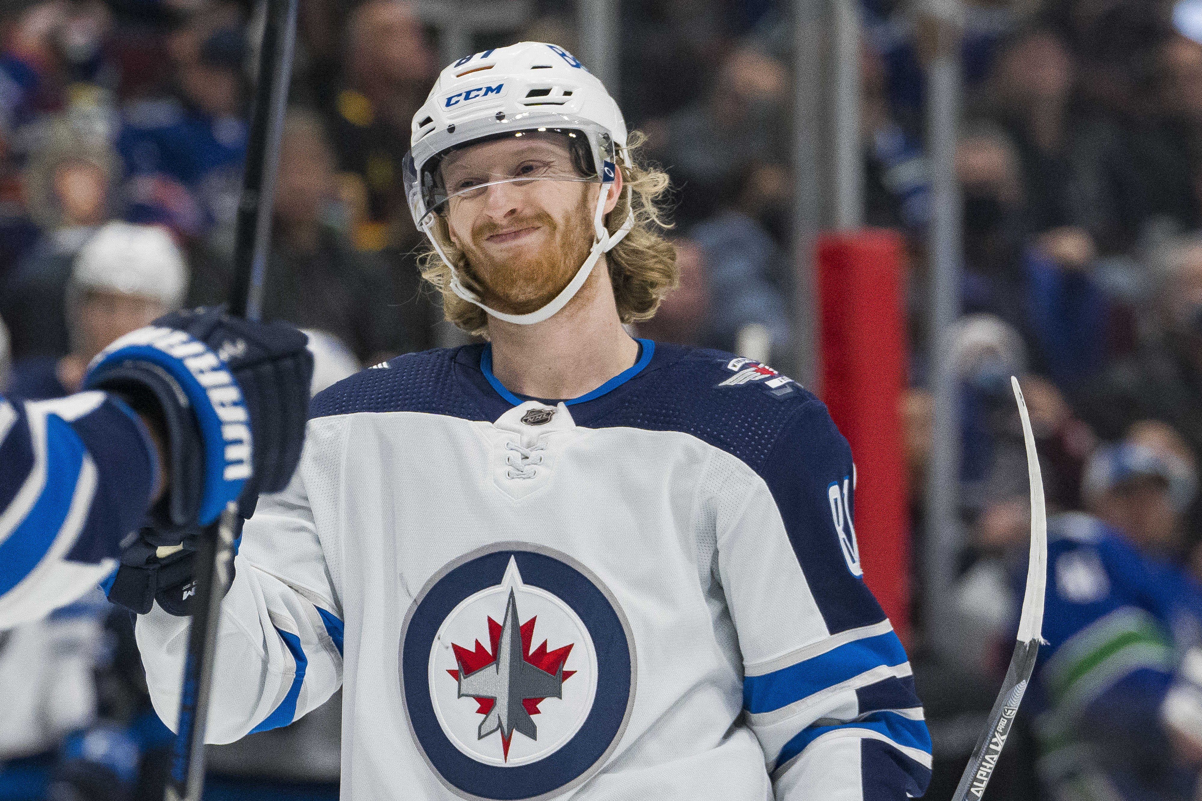 Dec 10, 2021; Vancouver, British Columbia, CAN; Winnipeg Jets forward Kyle Connor (81) celebrates a goal scored by forward Mark Scheifele (55) against the Vancouver Canucks in the second period at Rogers Arena.