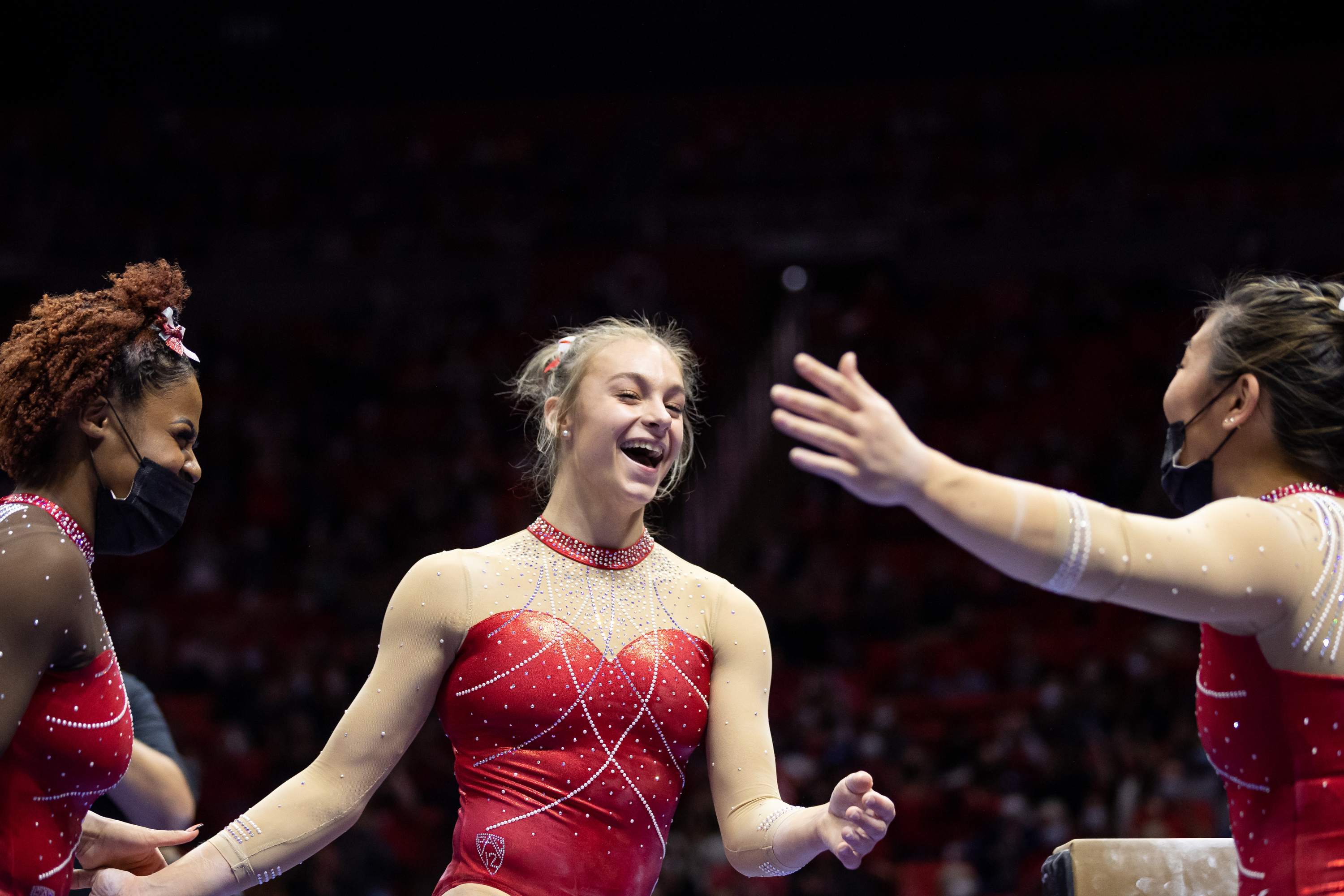 Utah’s Grace McCallum is congratulated by teammates during the gymnastics meet with Oklahoma at the Huntsman Center in Salt Lake City on Friday, Jan. 14, 2022.