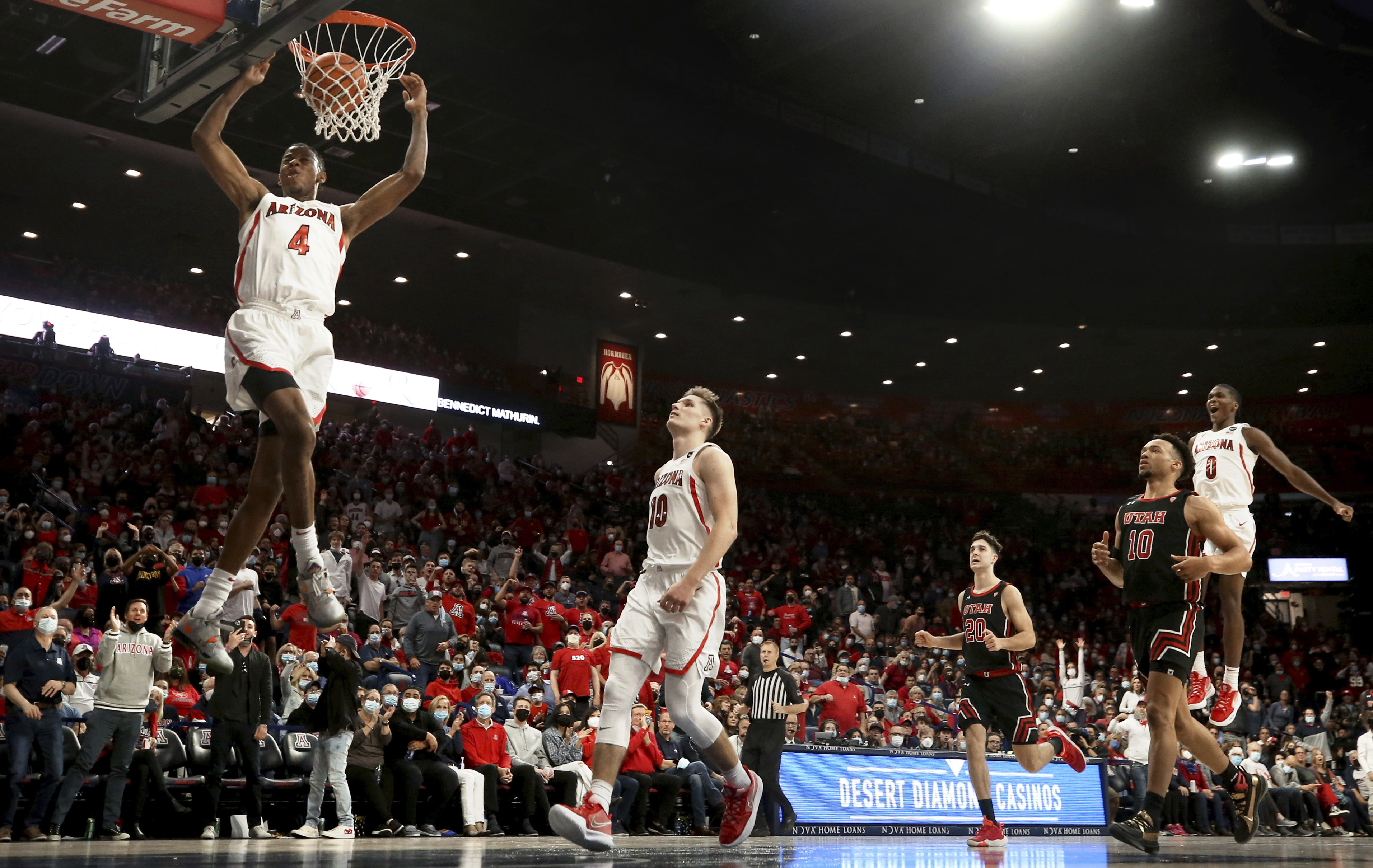 Arizona guard Dalen Terry (4) finishes off his steal with a dunk against Utah