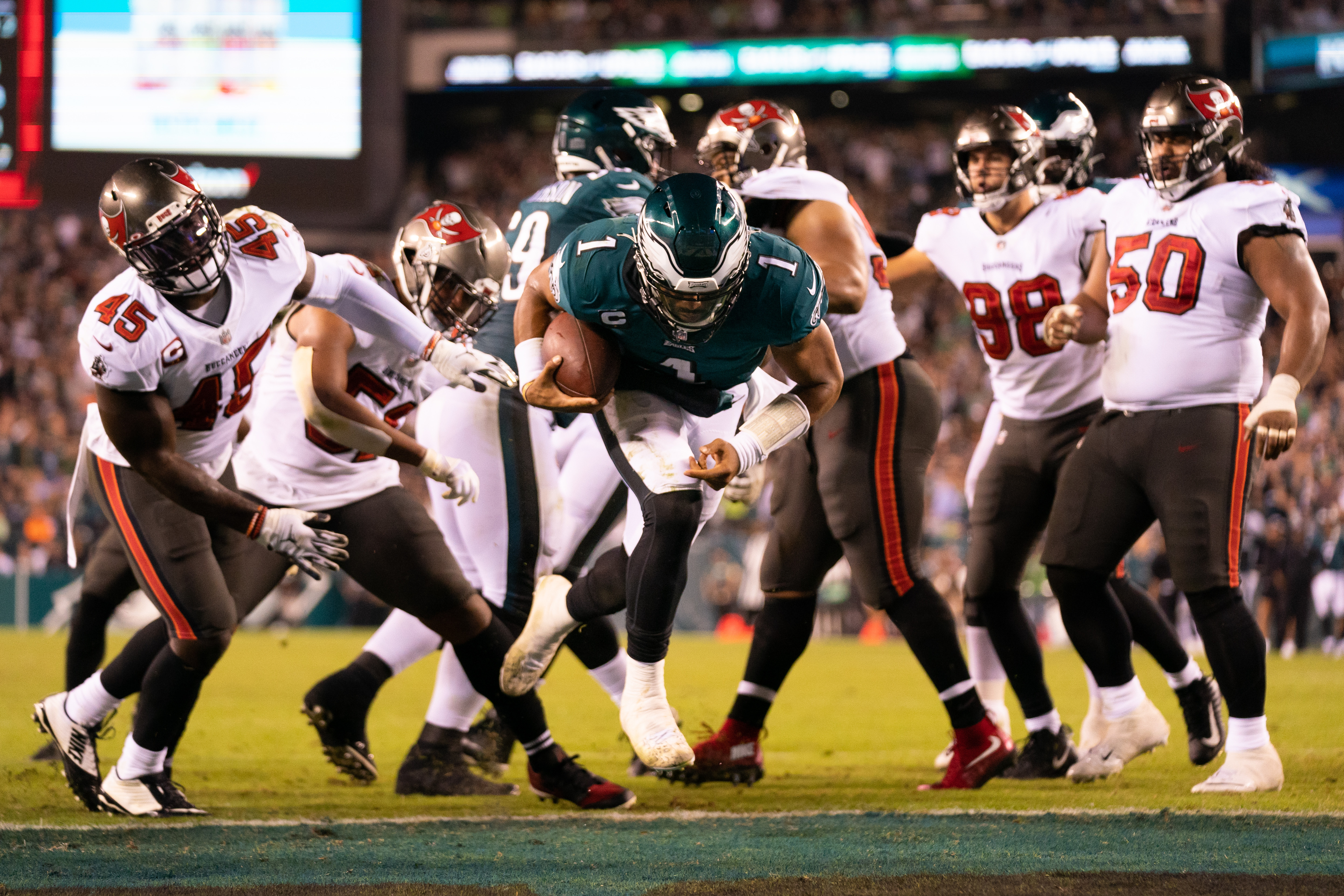Philadelphia Eagles quarterback Jalen Hurts (1) runs for a touchdown against the Tampa Bay Buccaneers during the fourth quarter at Lincoln Financial Field.