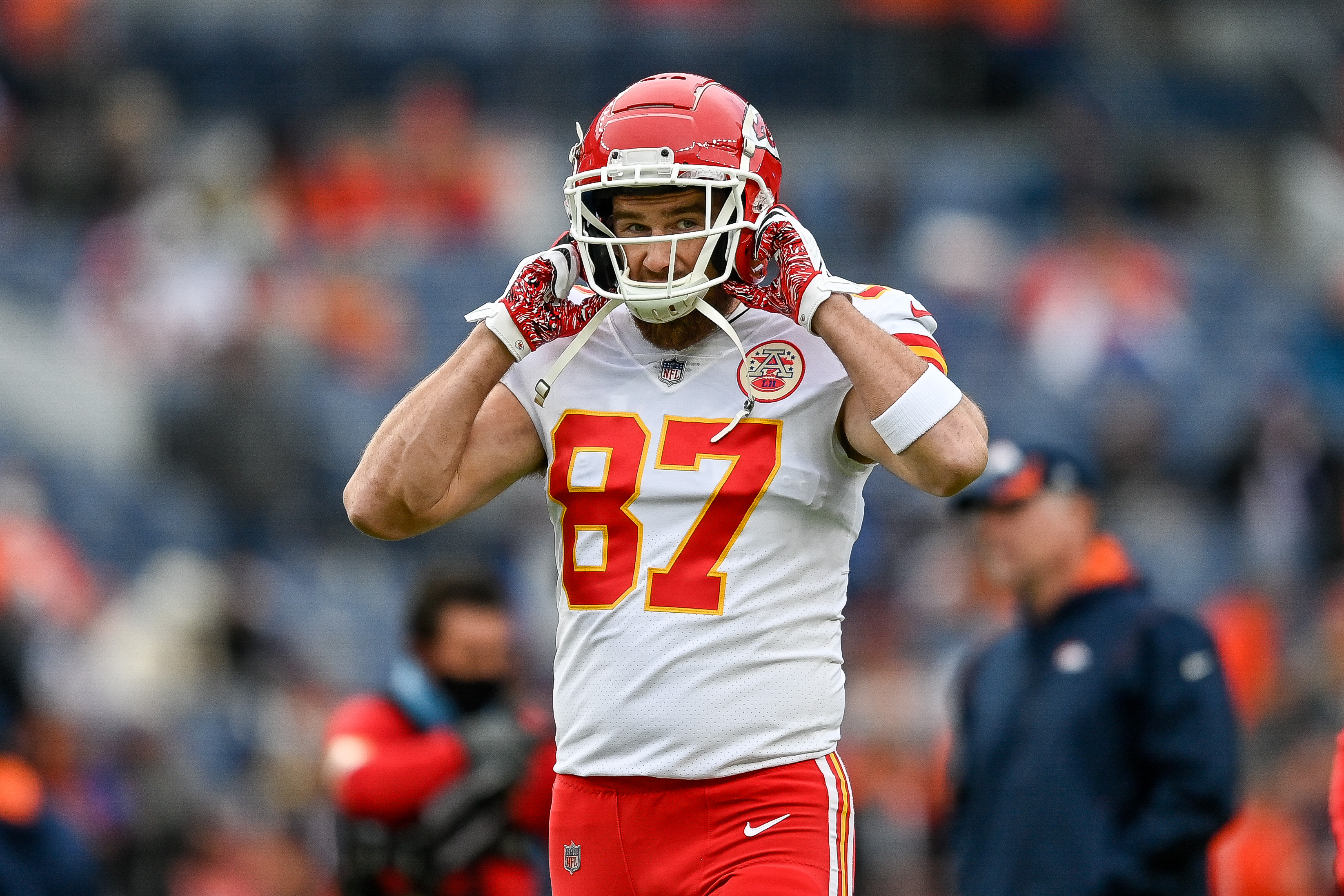 Travis Kelce #87 of the Kansas City Chiefs walks on the field before a game against the Denver Broncos at Empower Field at Mile High on January 8, 2022 in Denver, Colorado.