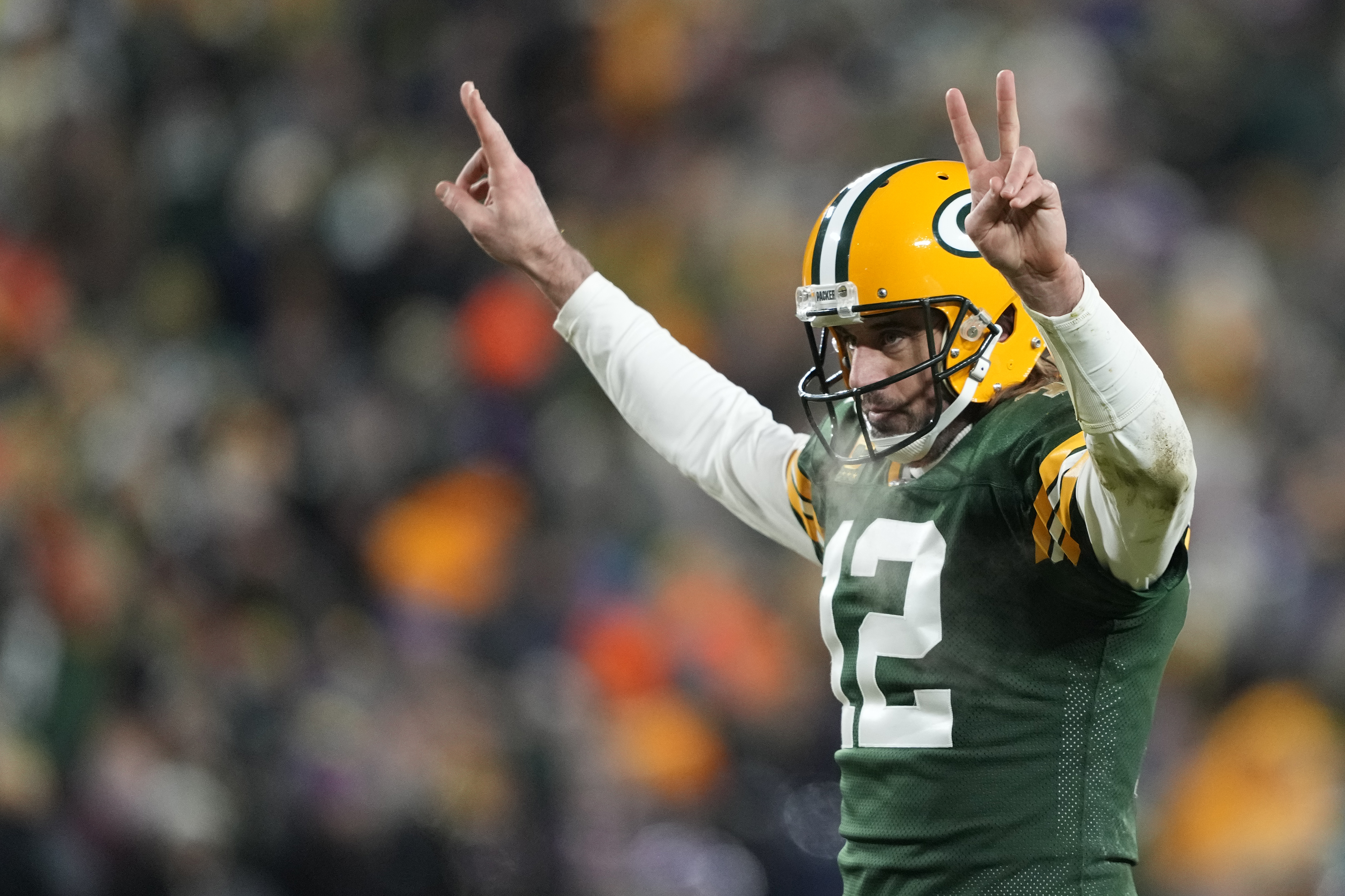 Quarterback Aaron Rodgers #12 of the Green Bay Packers celebrates after a touchdown during the 3rd quarter of the game against the Minnesota Vikings at Lambeau Field on January 02, 2022 in Green Bay, Wisconsin.