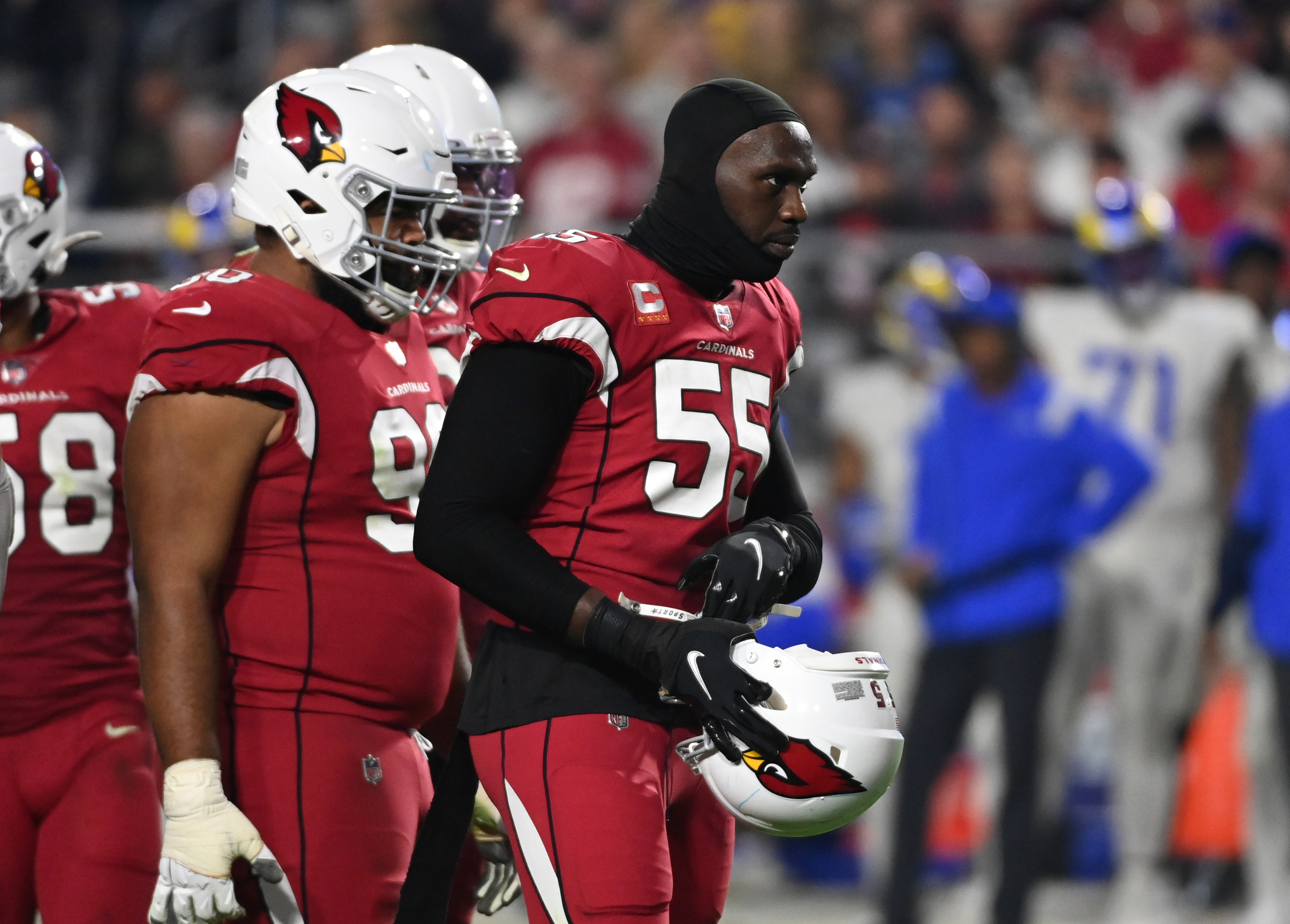 Chandler Jones #55 of the Arizona Cardinals looks at the the Los Angeles Rams huddle at State Farm Stadium on December 13, 2021 in Glendale, Arizona.