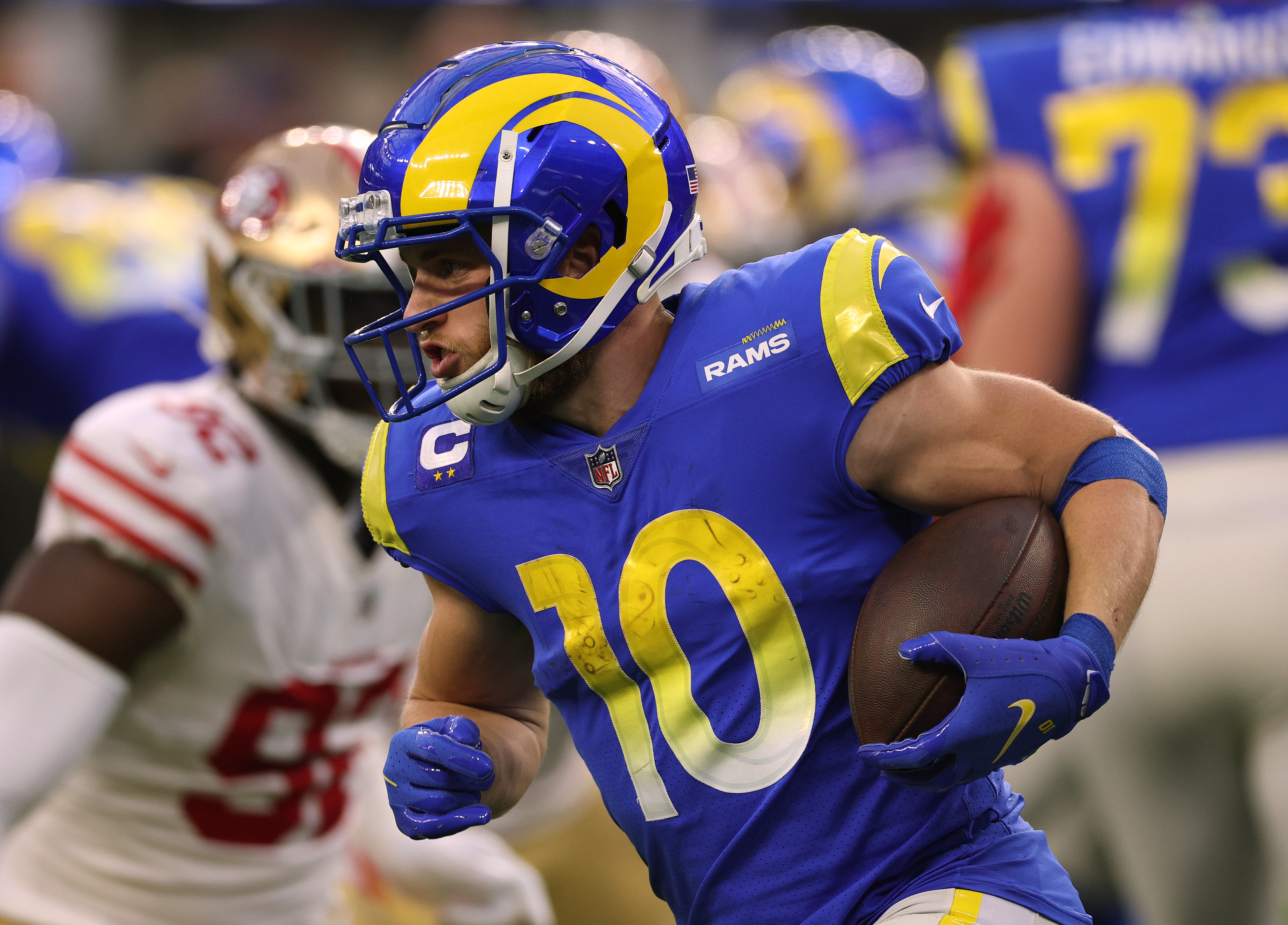 Cooper Kupp #10 of the Los Angeles Rams runs after a handoff during a 27-24 loss to the San Francisco 49ers at SoFi Stadium on January 09, 2022 in Inglewood, California.