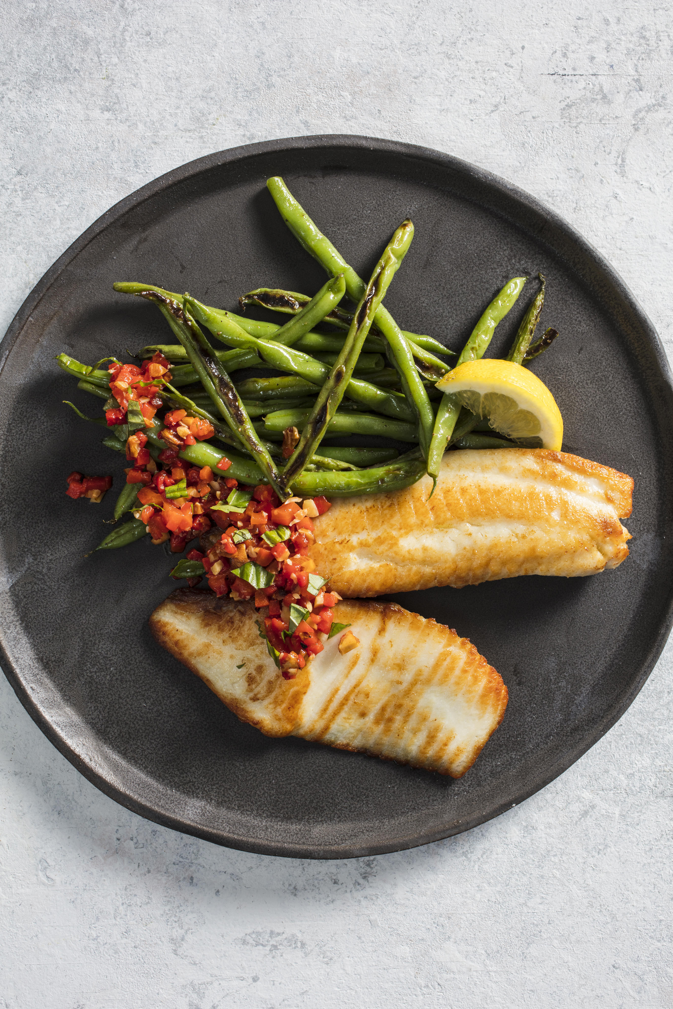 Pan-seared tilapia with blistered green beans and red pepper relish.