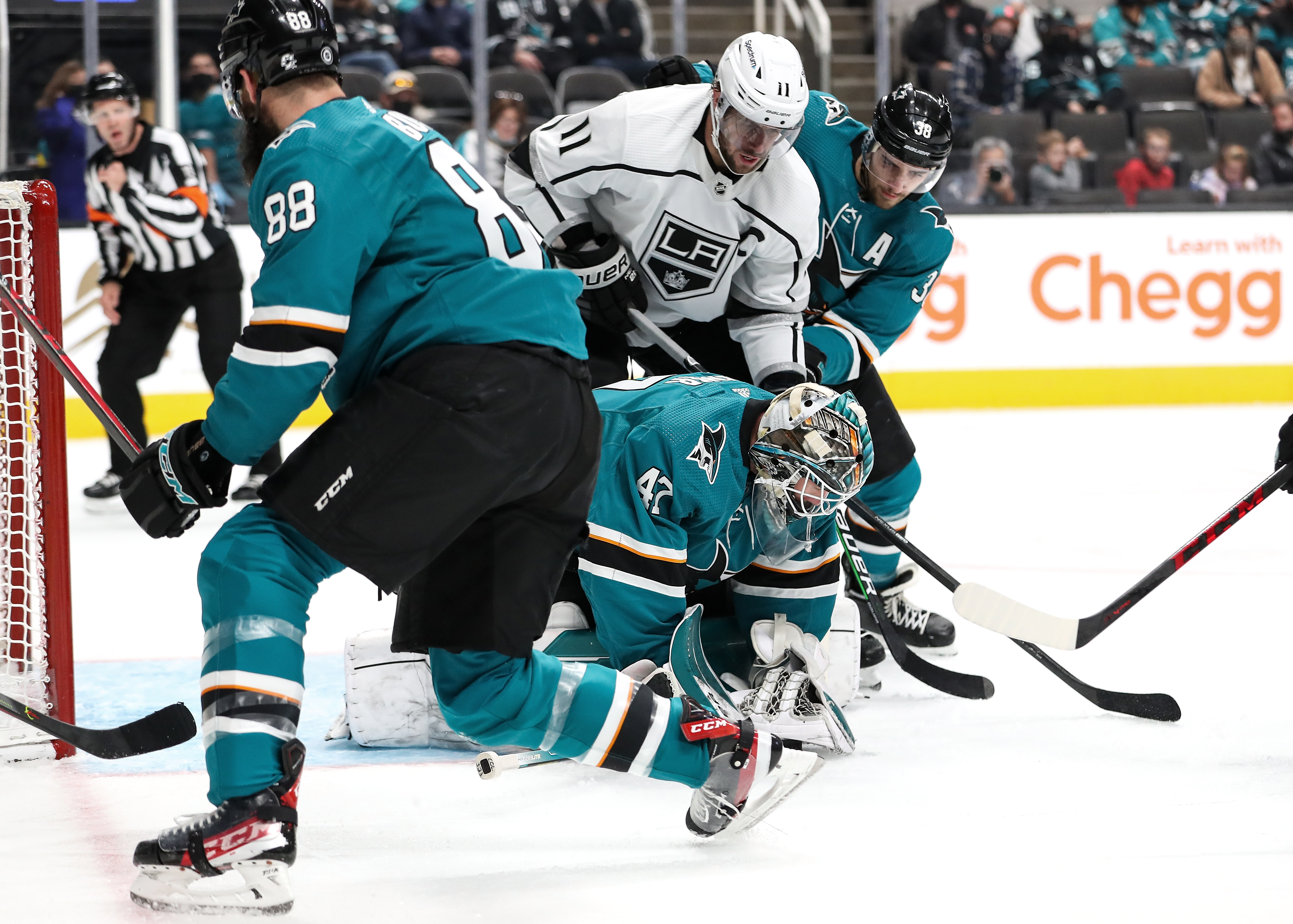 James Reimer #47 of the San Jose Sharks dives on the puck to make the save against the Los Angeles Kings at SAP Center on January 17, 2022 in San Jose, California.&nbsp;