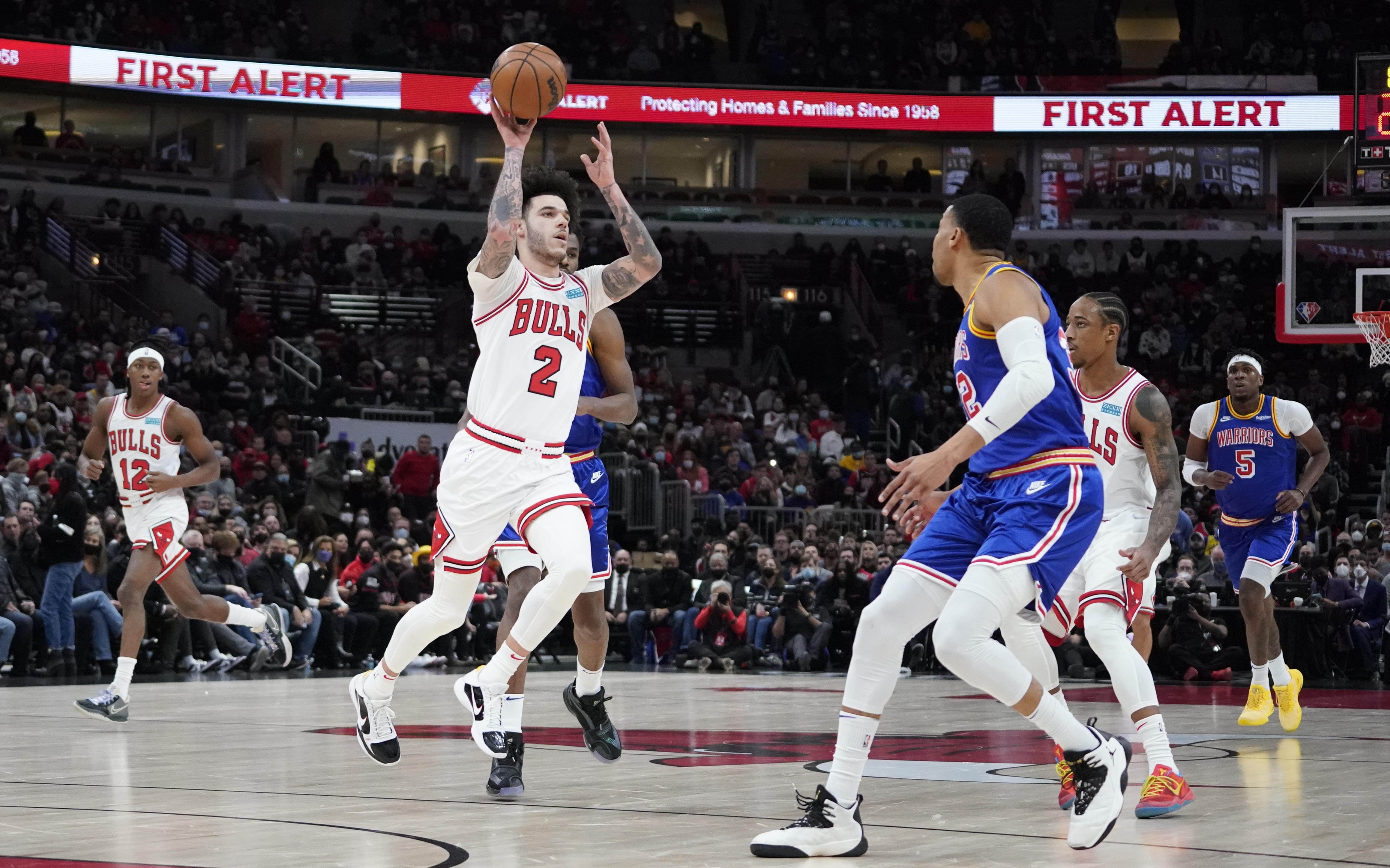 Chicago Bulls guard Lonzo Ball (2) looks to pass the ball against the Golden State Warriors during the first half at United Center.
