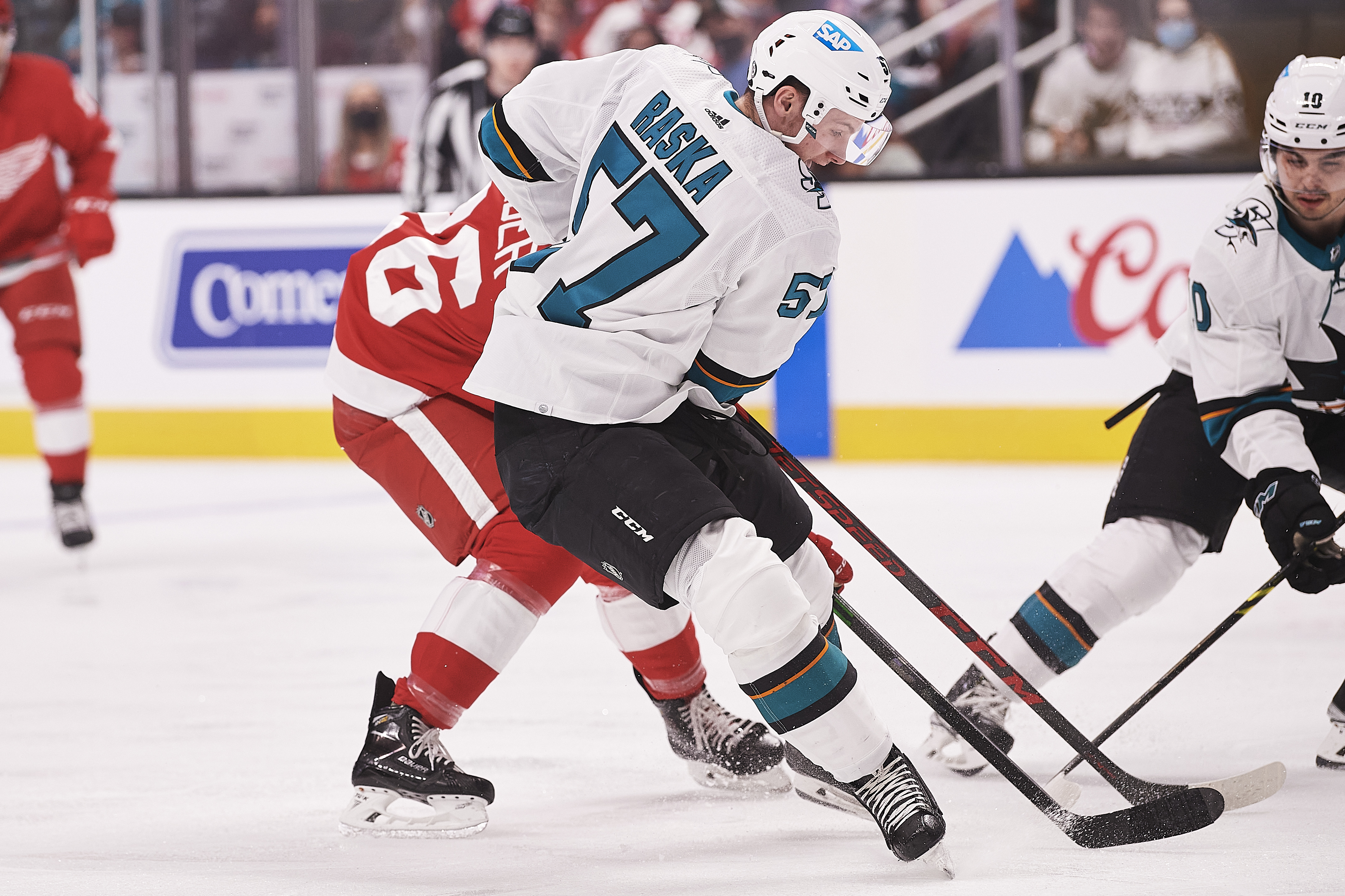 San Jose Sharks right wing Adam Raska (57) fights for the puck during the NHL game between the San Jose Sharks and the Detroit Red Wings on January 11, 2022 at SAP Center in San Jose, CA.