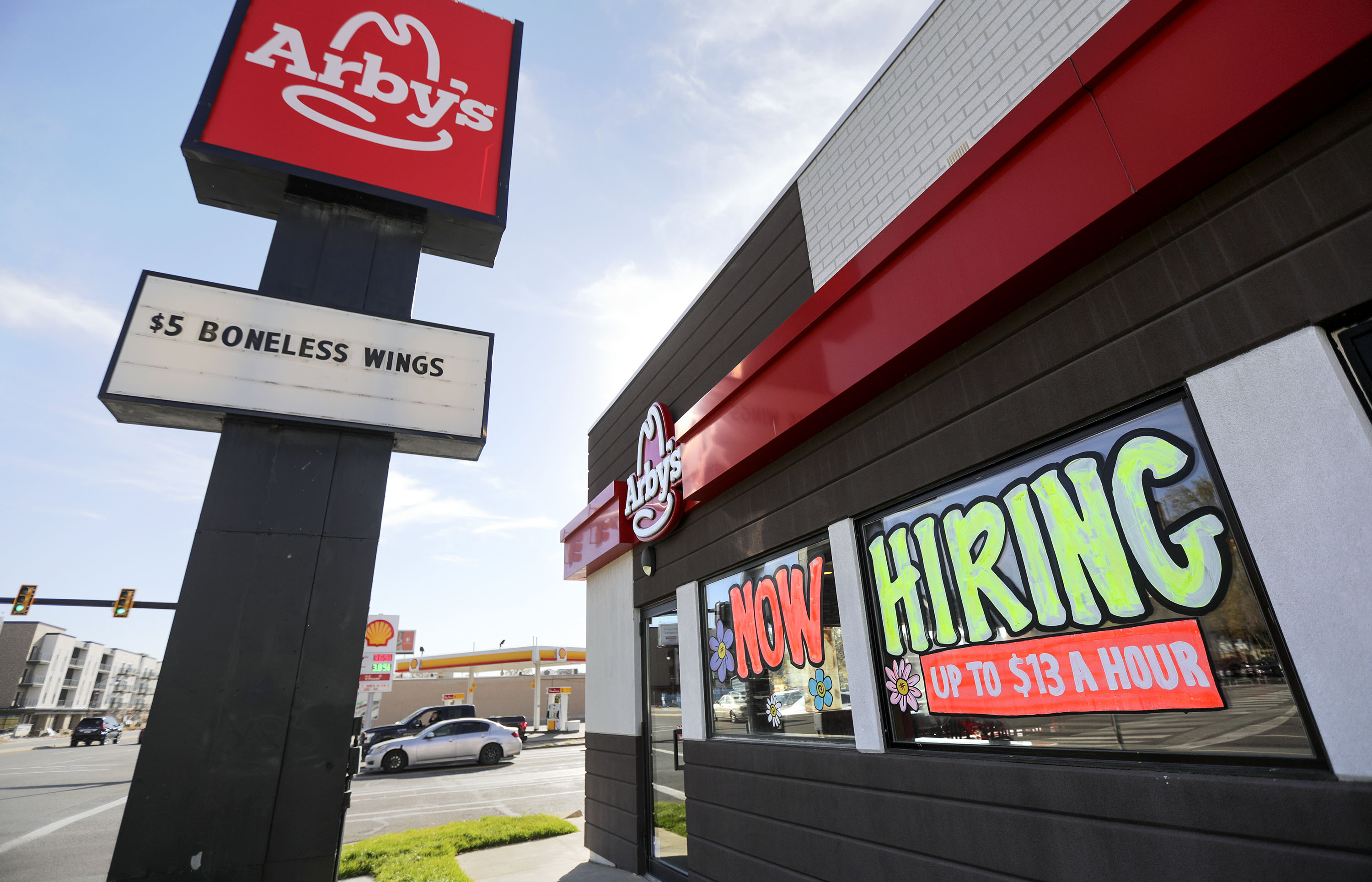 A “now hiring” sign is pictured at an Arby’s in Salt Lake City on Friday, Nov. 5, 2021.