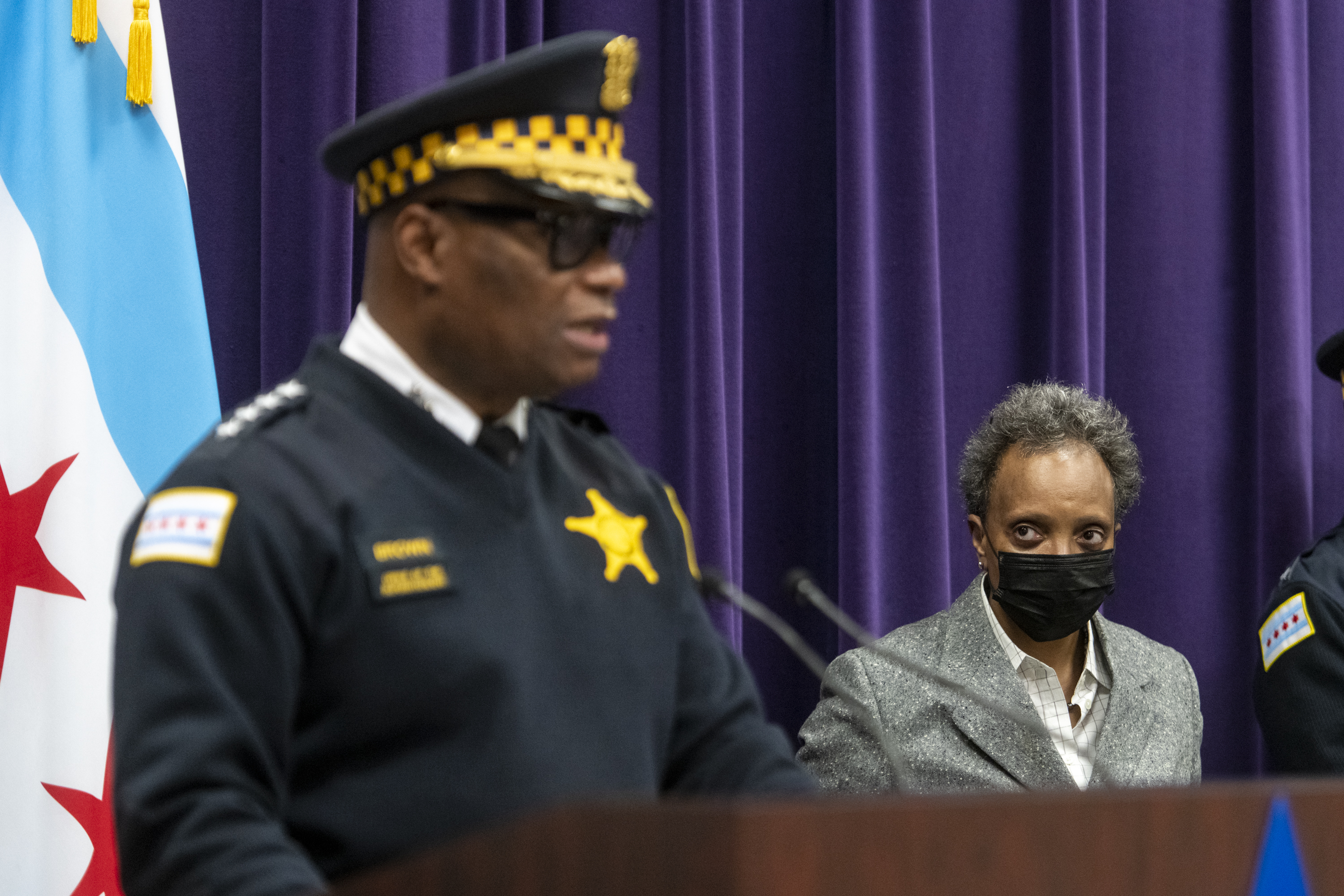 Mayor Lori Lightfoot, right, listens as Chicago Police Supt. David Brown speaks to reporters at a press conference at Chicago Police Headquarters on Jan. 4, 2022.