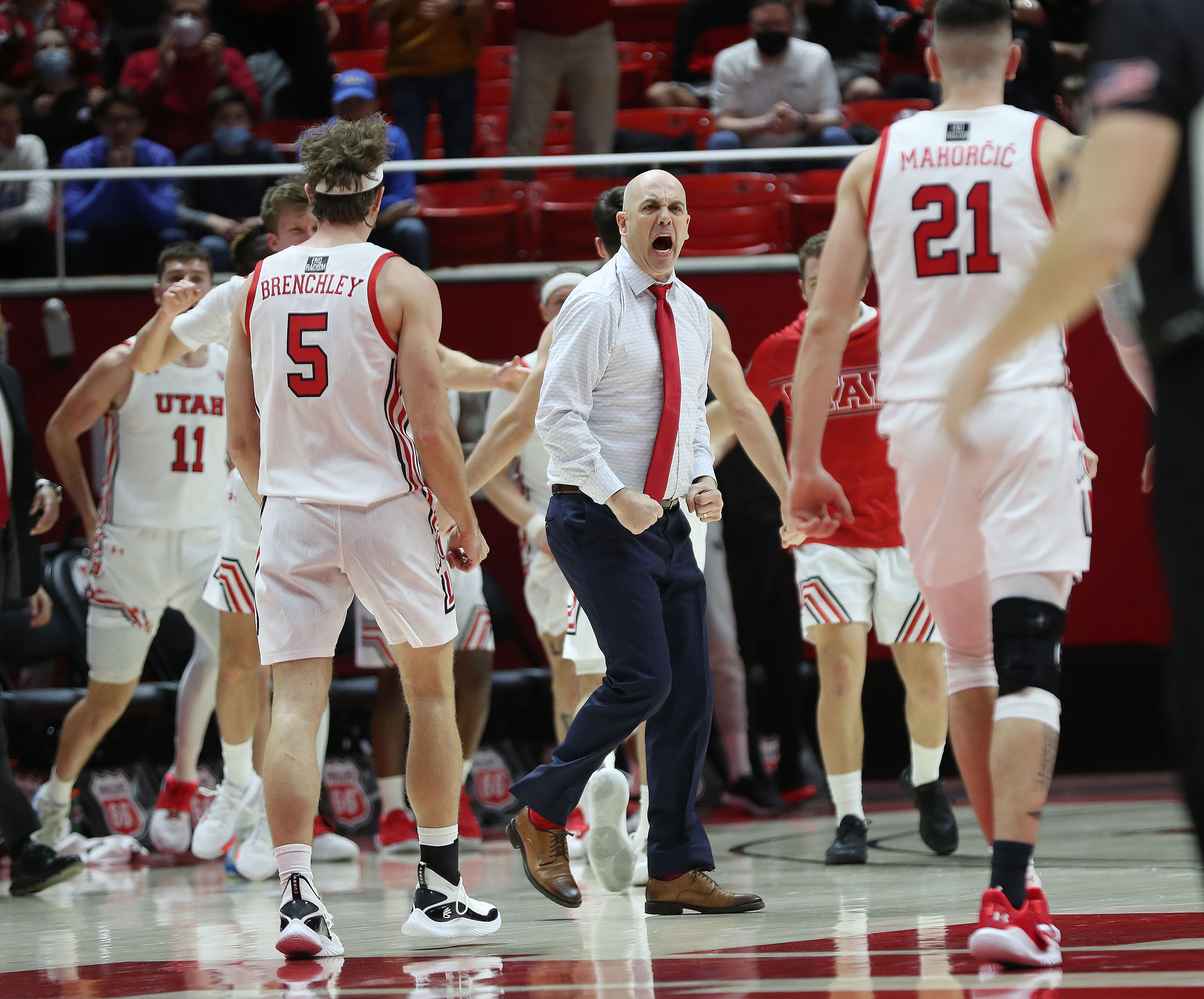 Utah Utes head coach Craig Smith celebrates after a Ute defensive stand against UCLA in Salt Lake City.