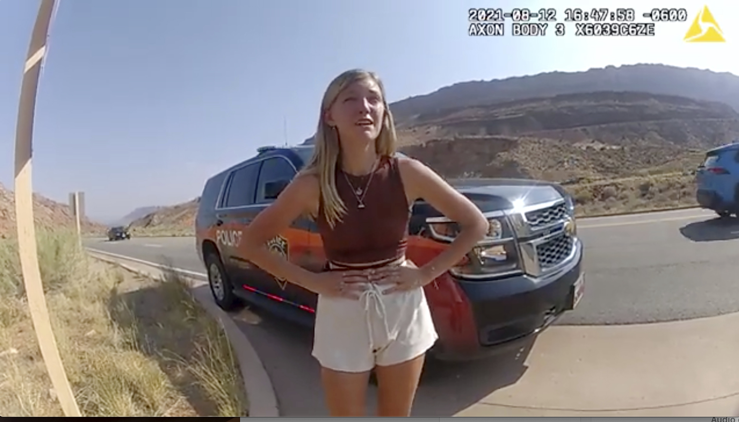This police camera video provided by The Moab Police Department shows Gabrielle “Gabby” Petito talking to a police officer after police pulled over the van she was traveling in with her boyfriend, Brian Laundrie, near the entrance to Arches National Park on Aug. 12, 2021.