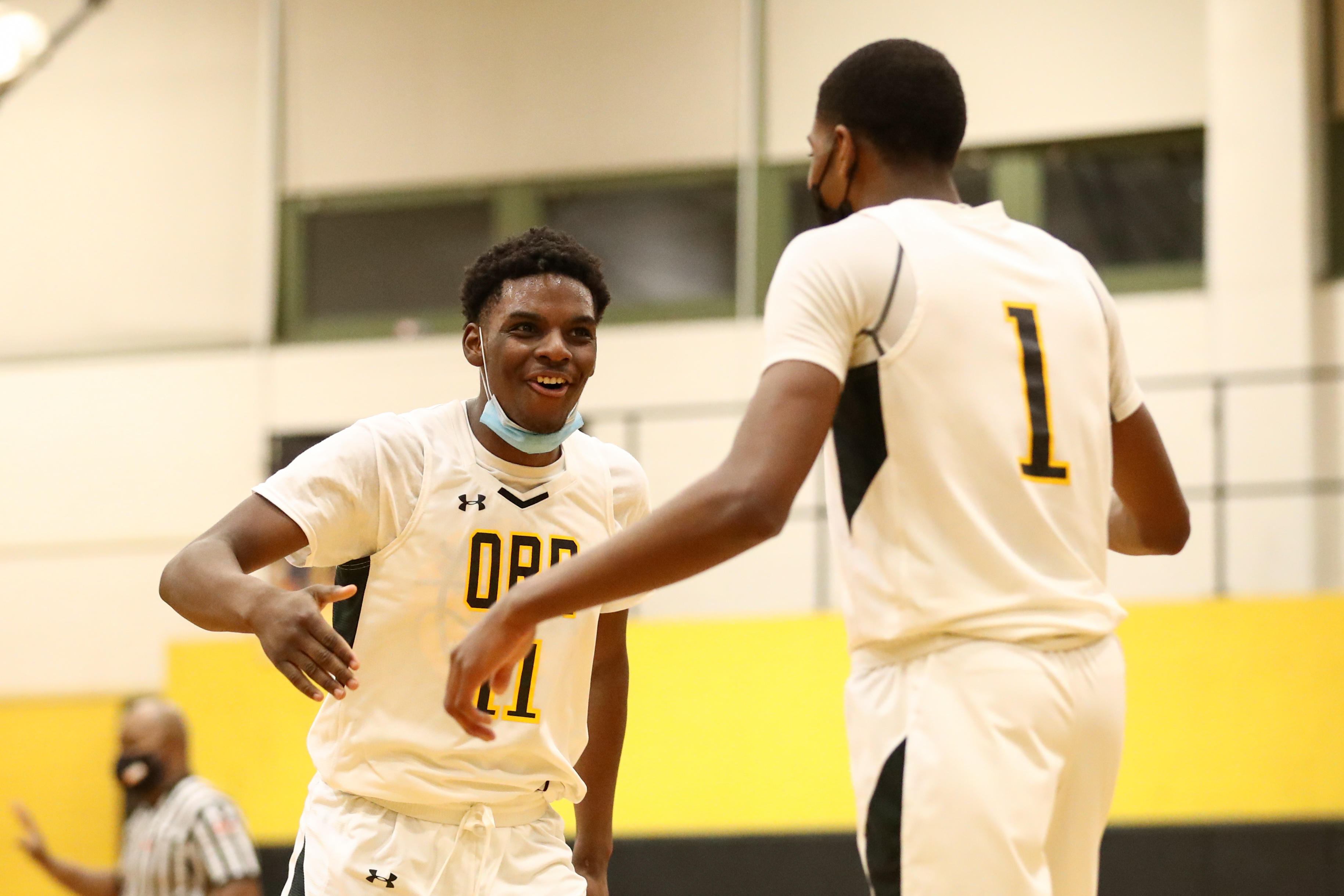 Orr’s Davion McCarthy (11) reacts with Caleb Hannah (1) during the game against Lane.