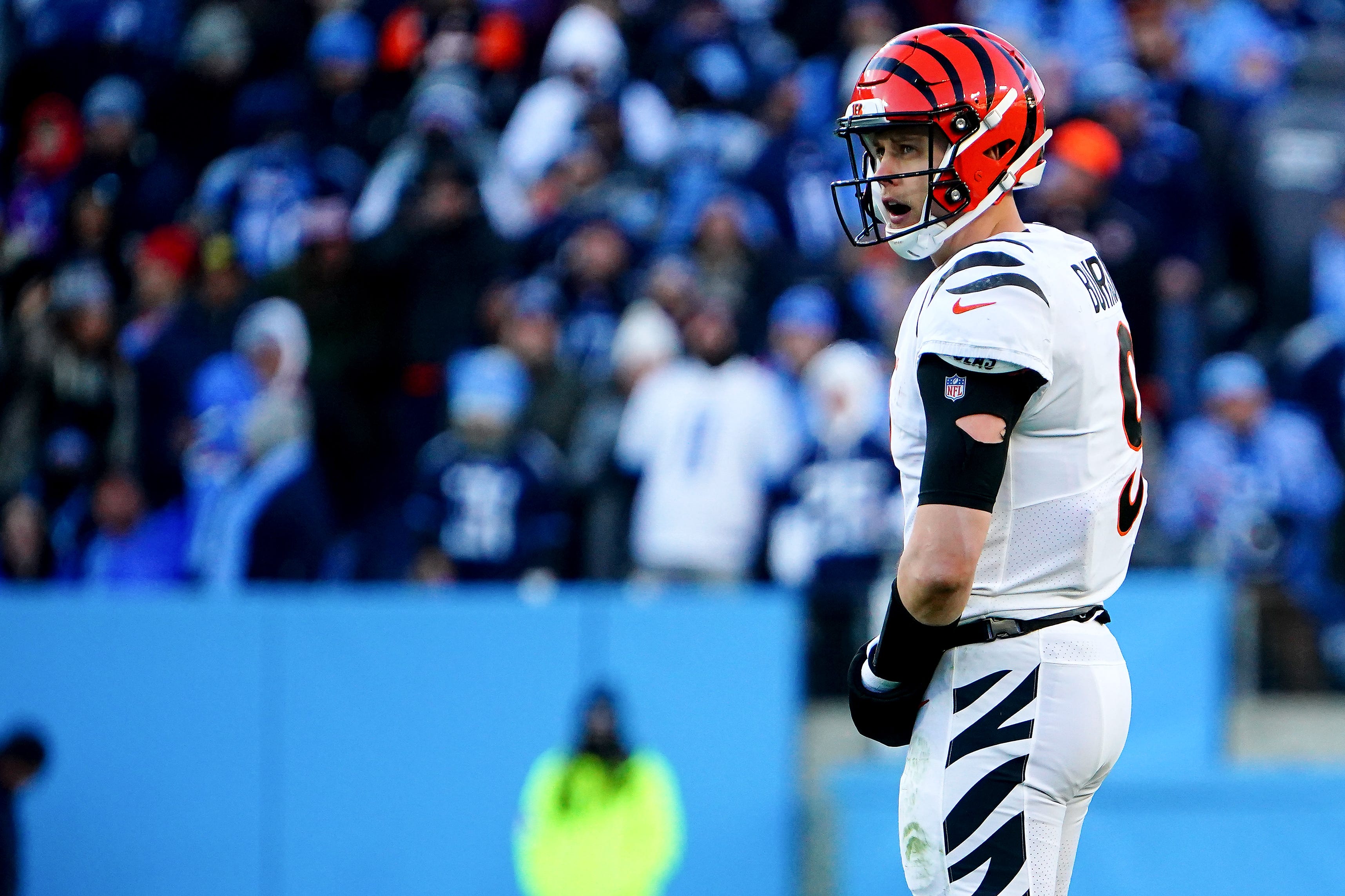 Cincinnati Bengals quarterback Joe Burrow (9) looks at the scoreboard in the first quarter during an NFL divisional playoff football game against the Tennessee Titans, Saturday, Jan. 22, 2022, at Nissan Stadium in Nashville. Cincinnati Bengals At Tennessee Titans Jan 22 Afc Divisional Playoffs