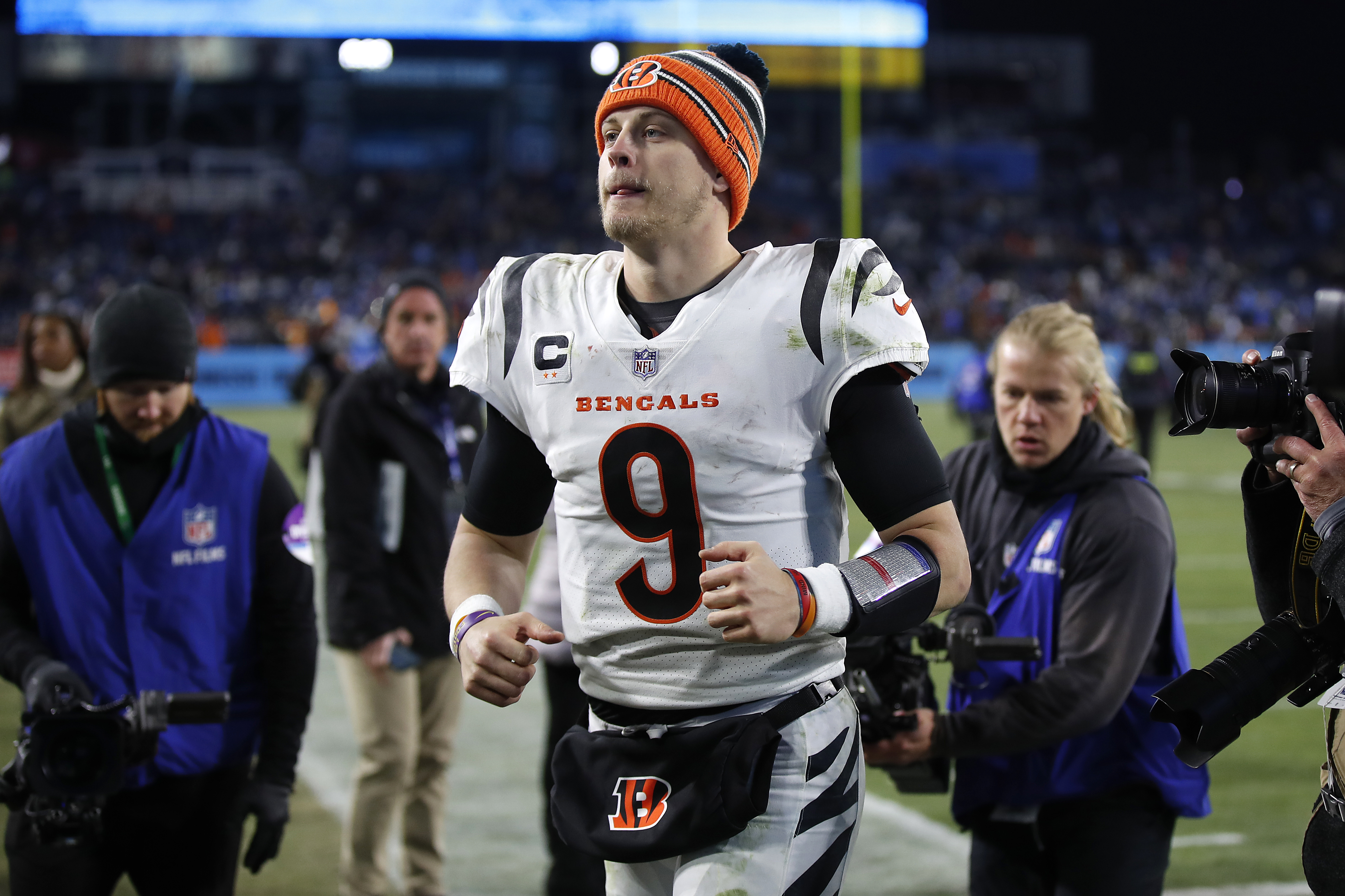 Quarterback Joe Burrow #9 of the Cincinnati Bengals runs off the field following the Bengals 19-16 win over the Tennessee Titans in the AFC Divisional Playoff game at Nissan Stadium on January 22, 2022 in Nashville, Tennessee.