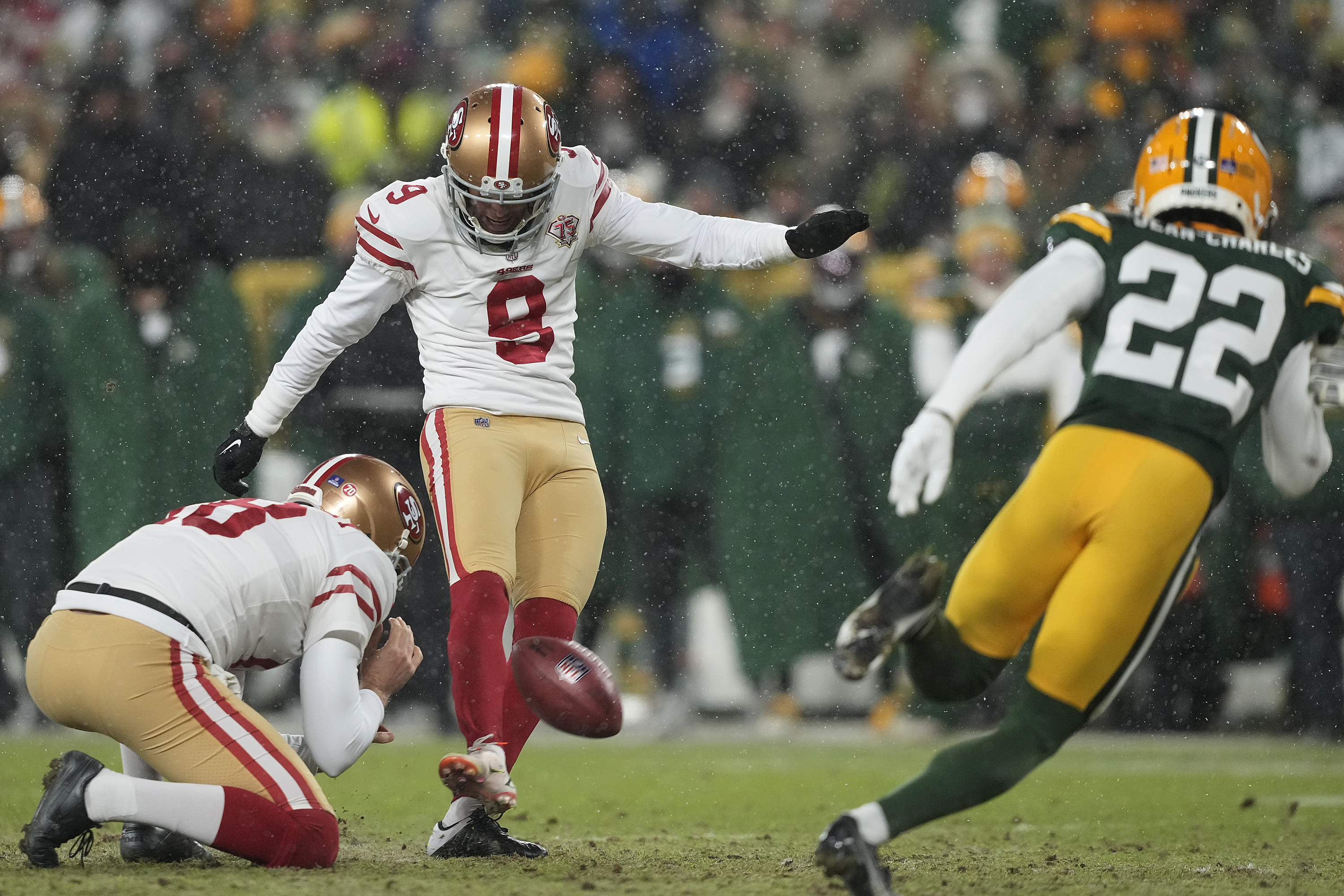 Kicker Robbie Gould #9 of the San Francisco 49ers kicks an extra point during the 4th quarter of the NFC Divisional Playoff game against the Green Bay Packers at Lambeau Field on January 22, 2022 in Green Bay, Wisconsin.