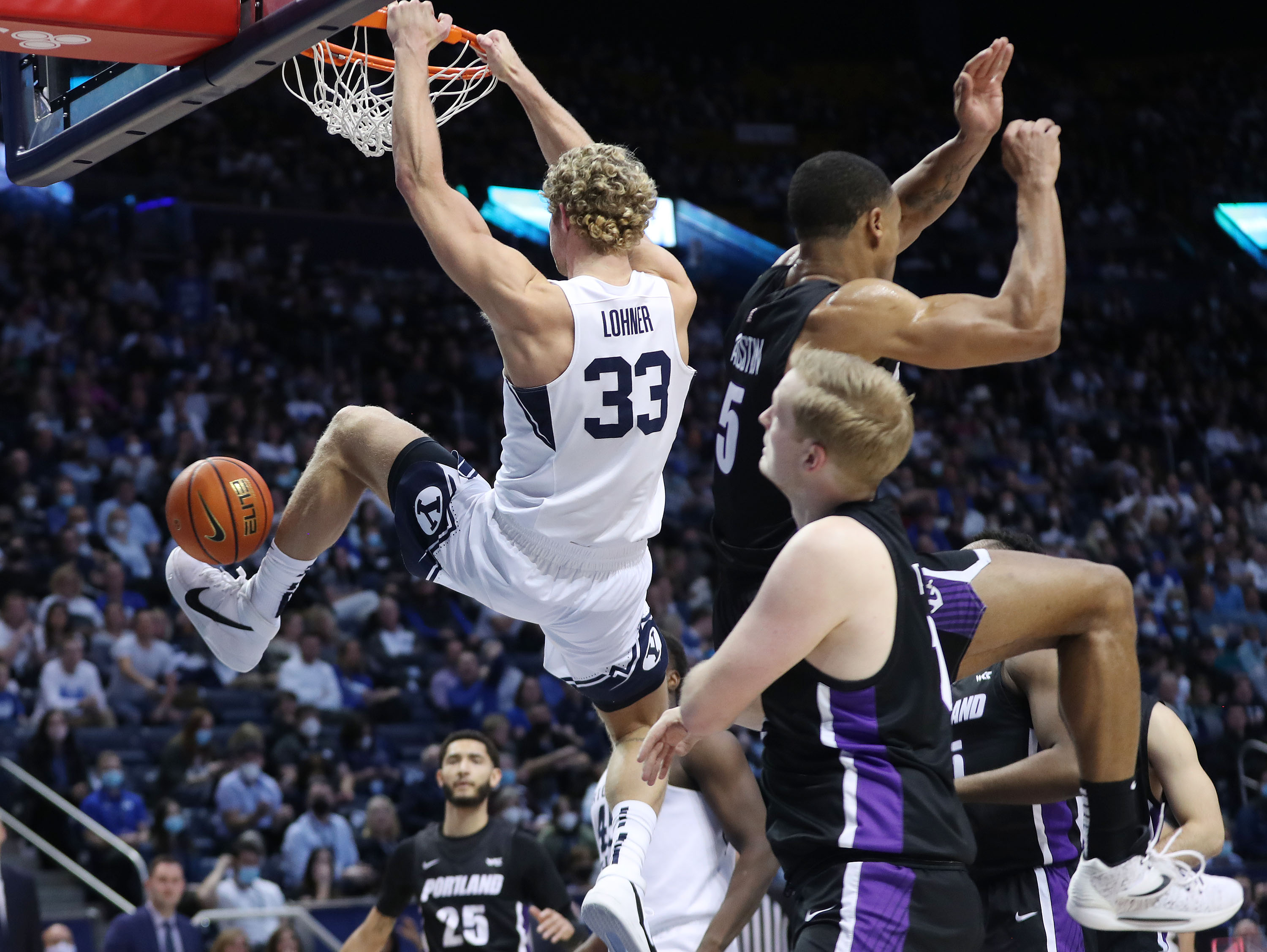 Brigham Young Cougars forward Caleb Lohner (33) dunks the ball in Provo on Saturday, Jan. 22, 2022.