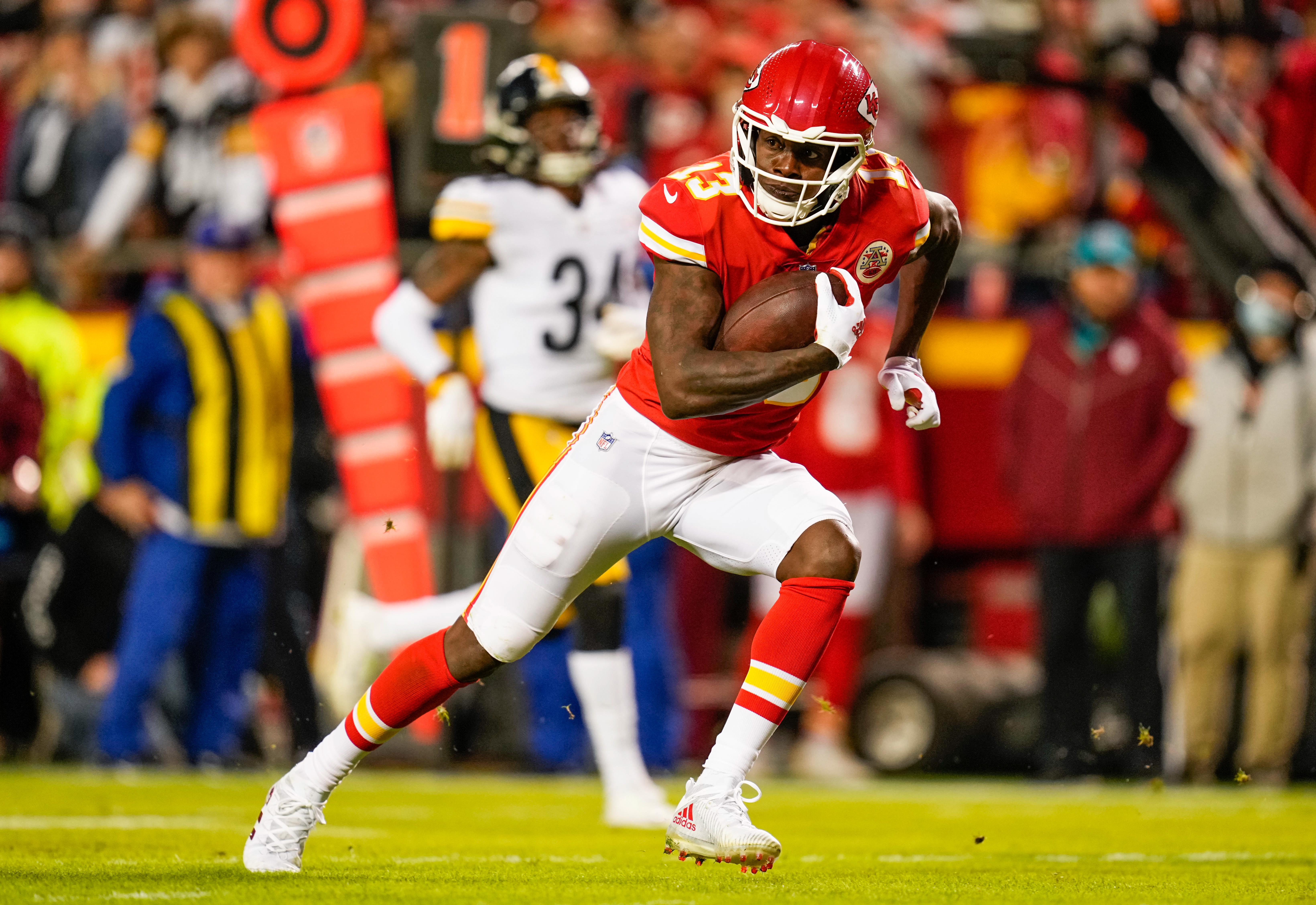 Kansas City Chiefs wide receiver Byron Pringle (13) runs the ball against the Pittsburgh Steelers during the second half at GEHA Field at Arrowhead Stadium.